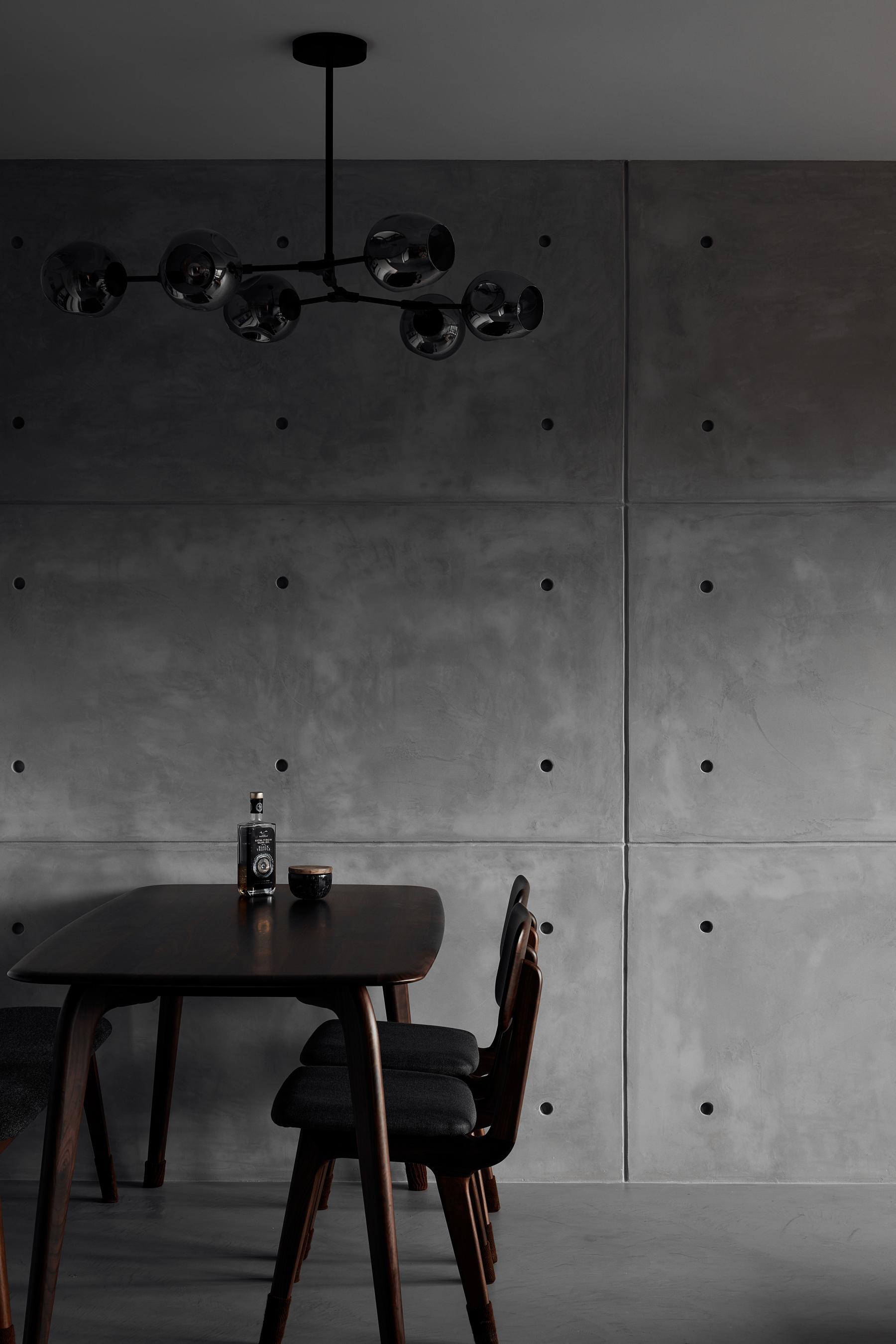 Industrial Dining Room with Drop Light and Dining Table
