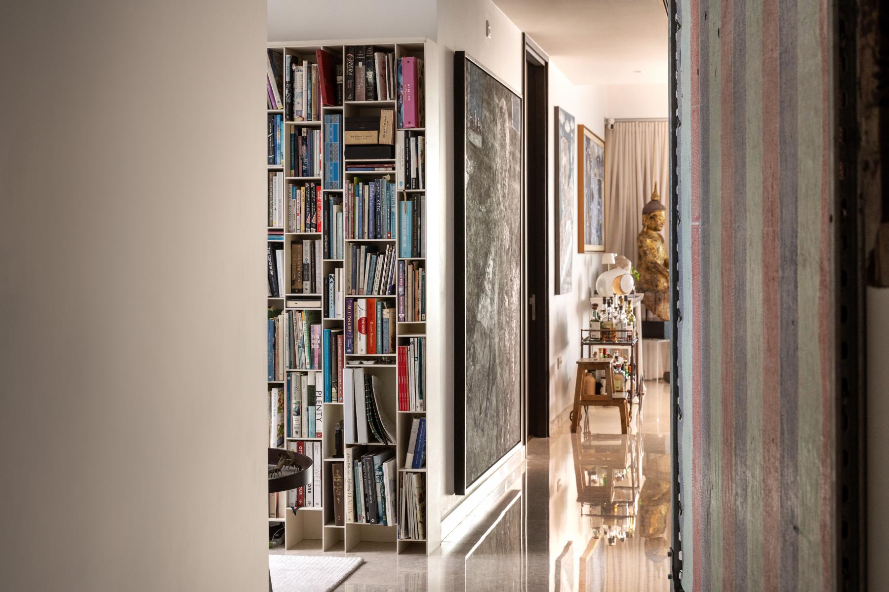 Contemporary Hallway with Bookshelf and Artwork