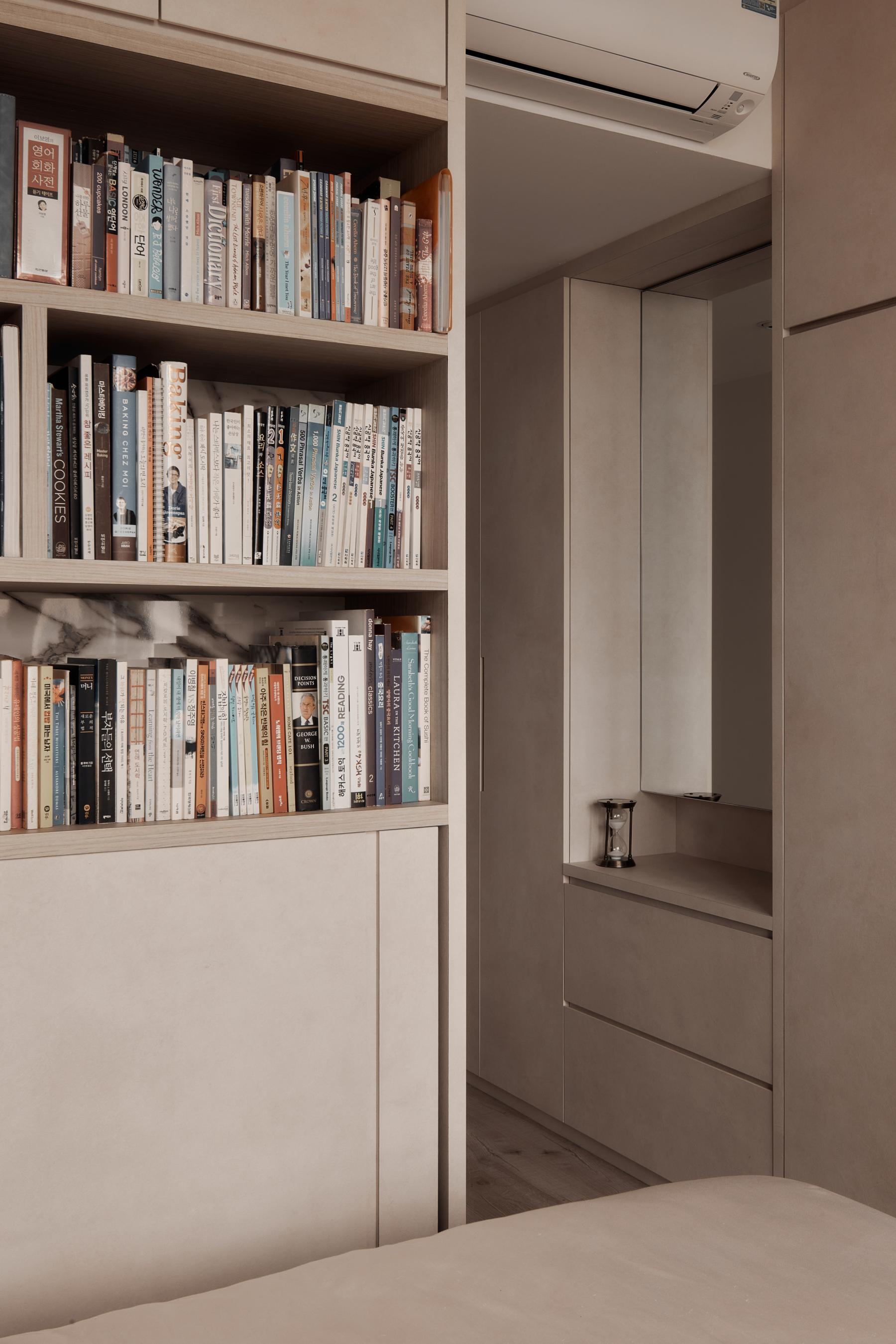 Modern Bedroom with Bookshelf and Wood Flooring