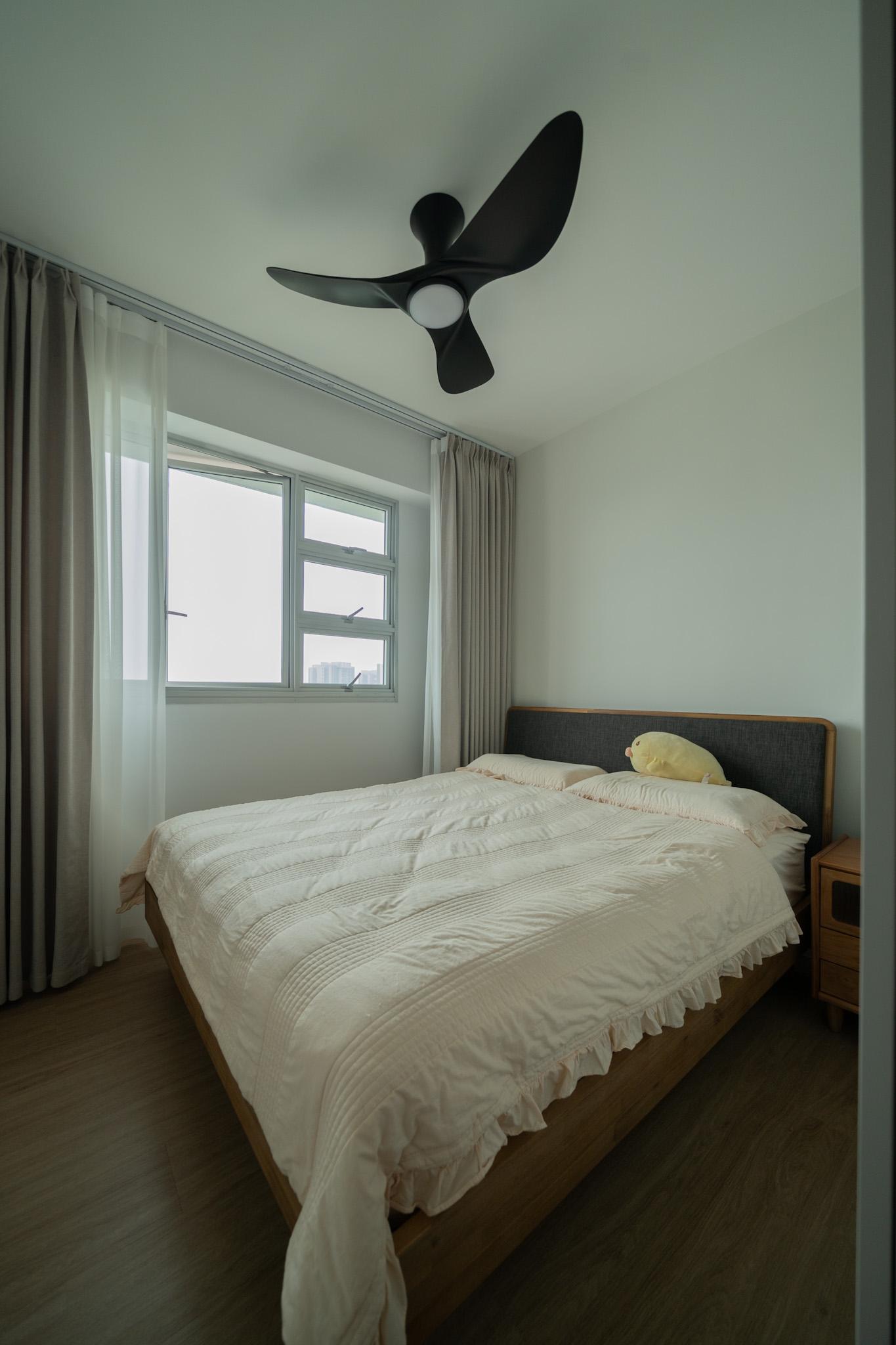 Minimalist Bedroom with Wood Flooring and Queen Bed