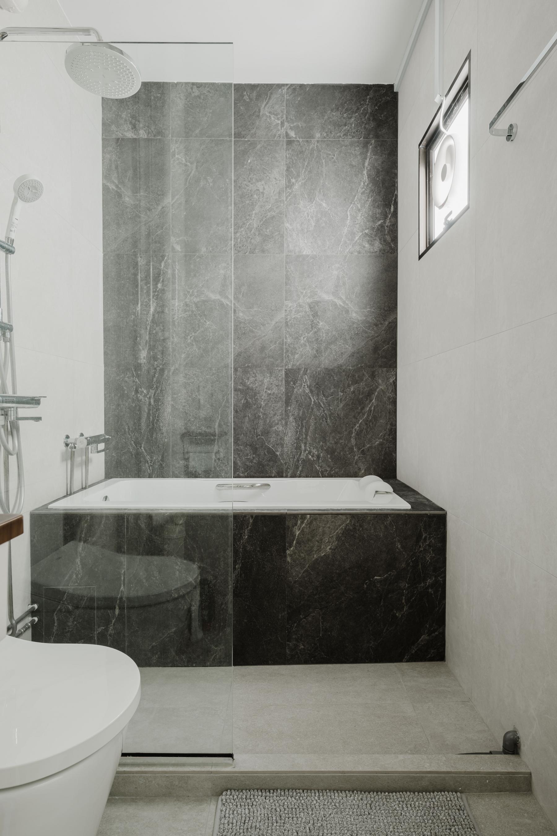 Scandinavian Bathroom with Bathtub and Toilet Bowl