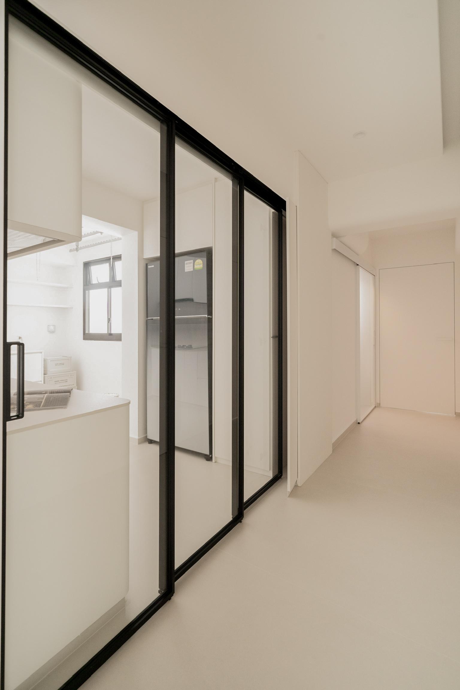 Minimalist Hallway with Glass Door and Doors