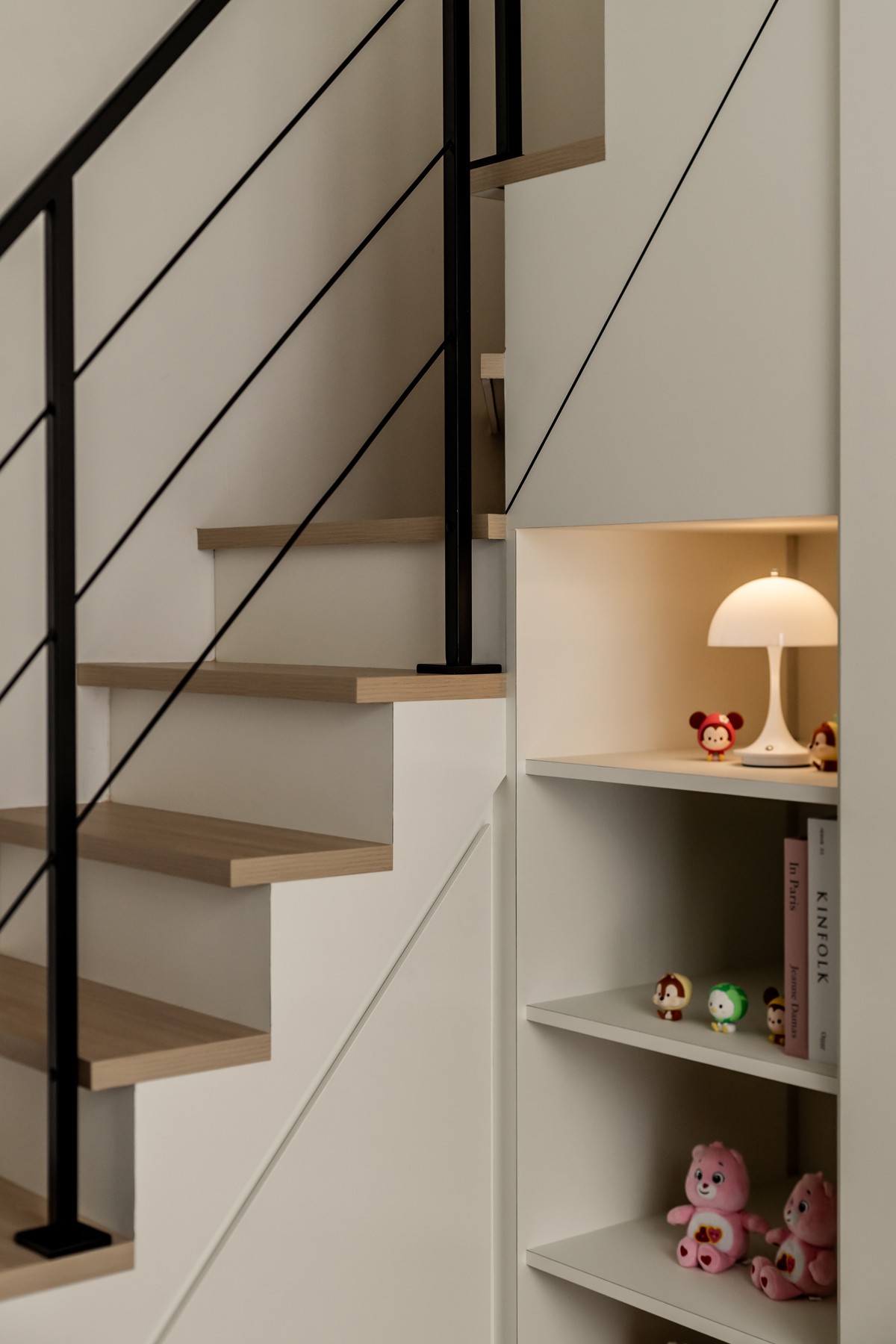 Contemporary Bedroom with Bookshelf and Staircase