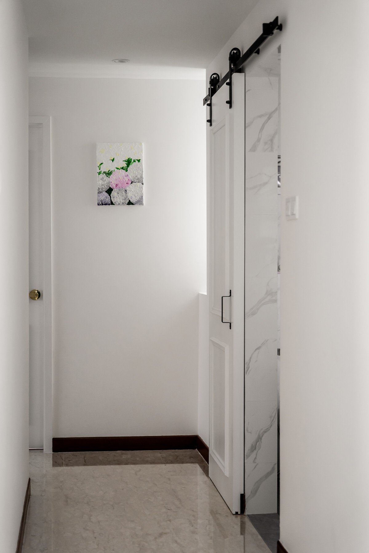 Modern Hallway with Marble Floor and Artwork