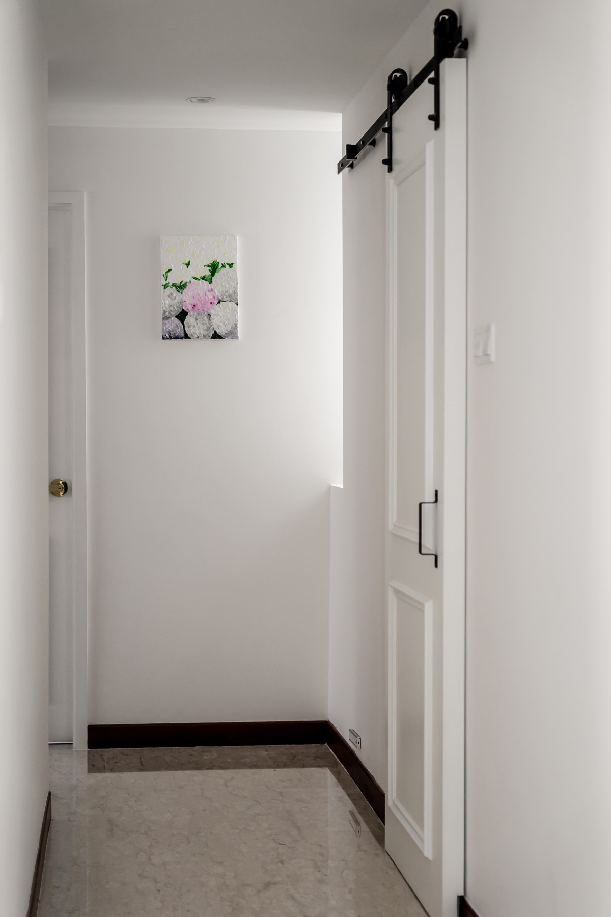 Modern Hallway with Marble Floor and Artwork