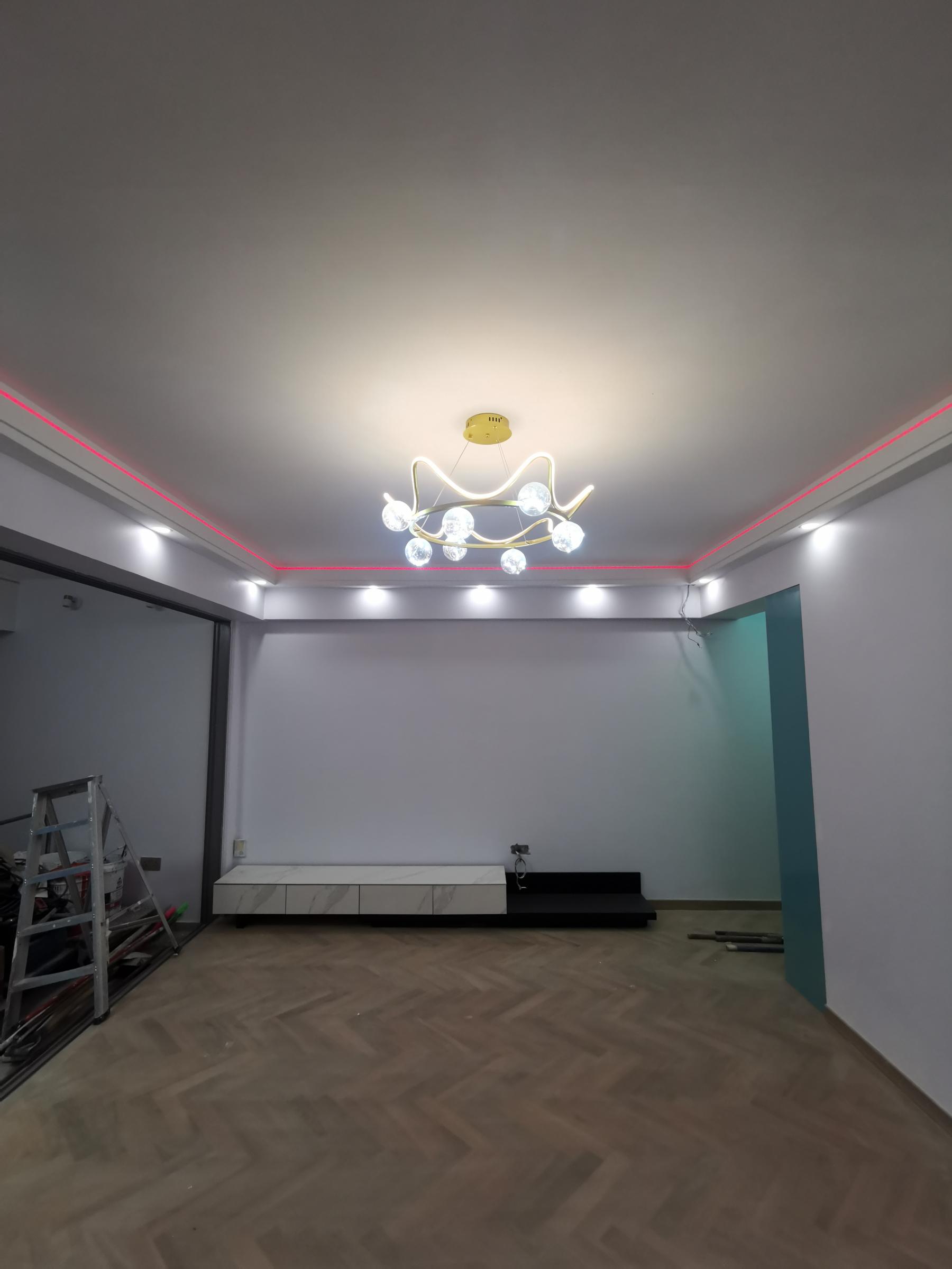 Contemporary Living Room with Herringbone Tiling and Wood Flooring
