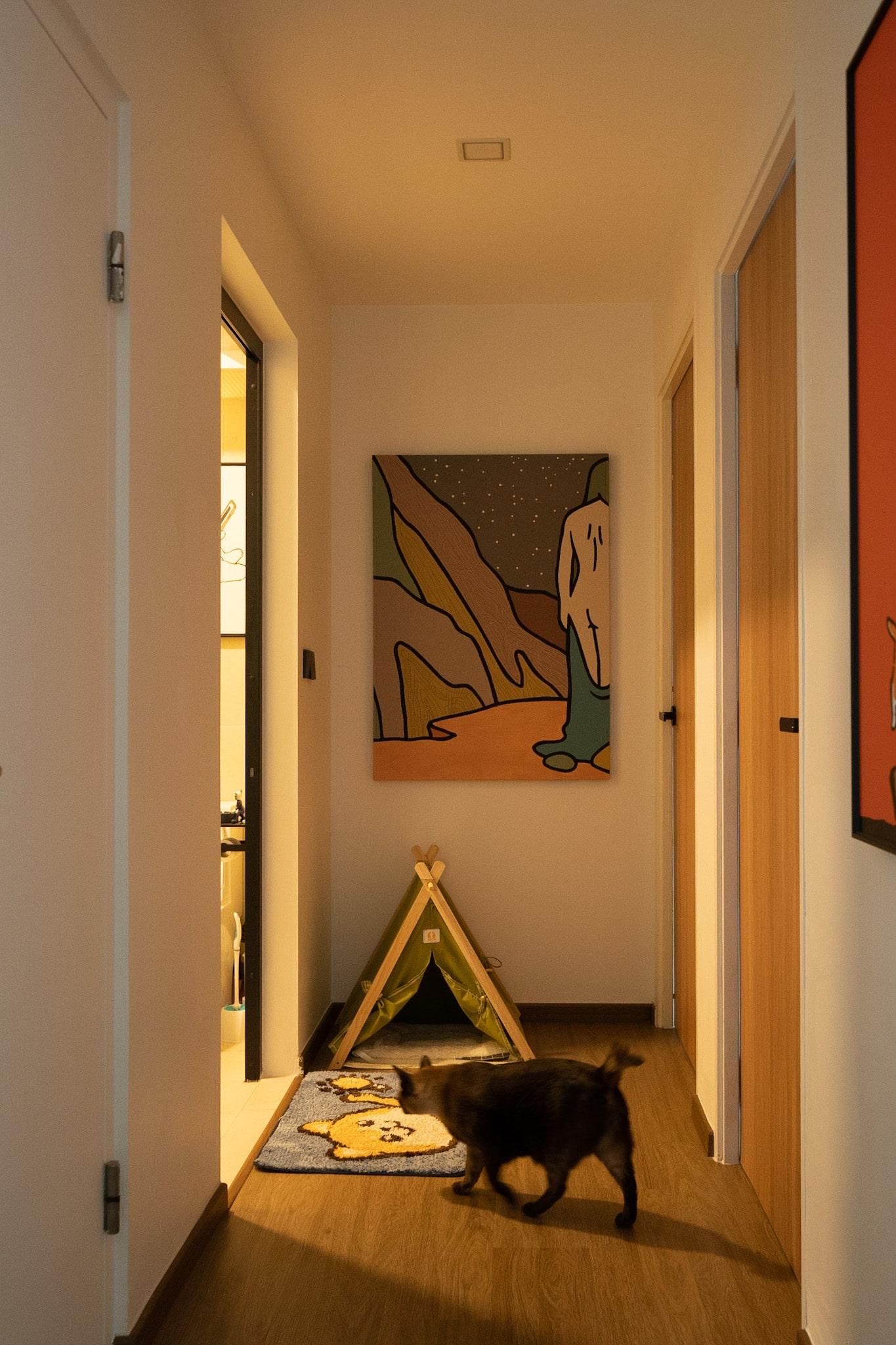 Modern Hallway with Bookshelf and Artwork