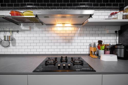 Transitional Kitchen at The Rojak Home