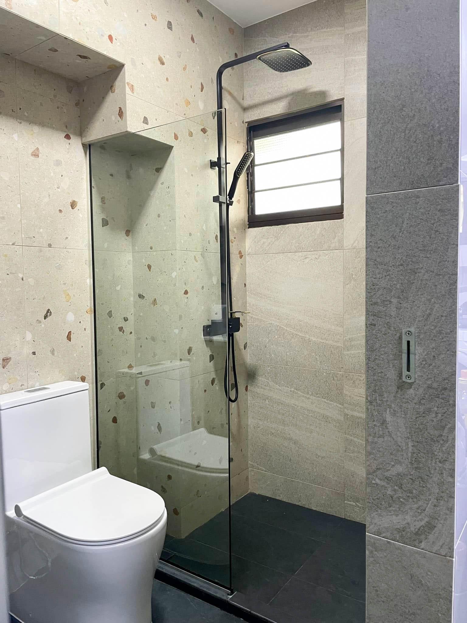 Transitional Bathroom with Feature Wall and Glass Door