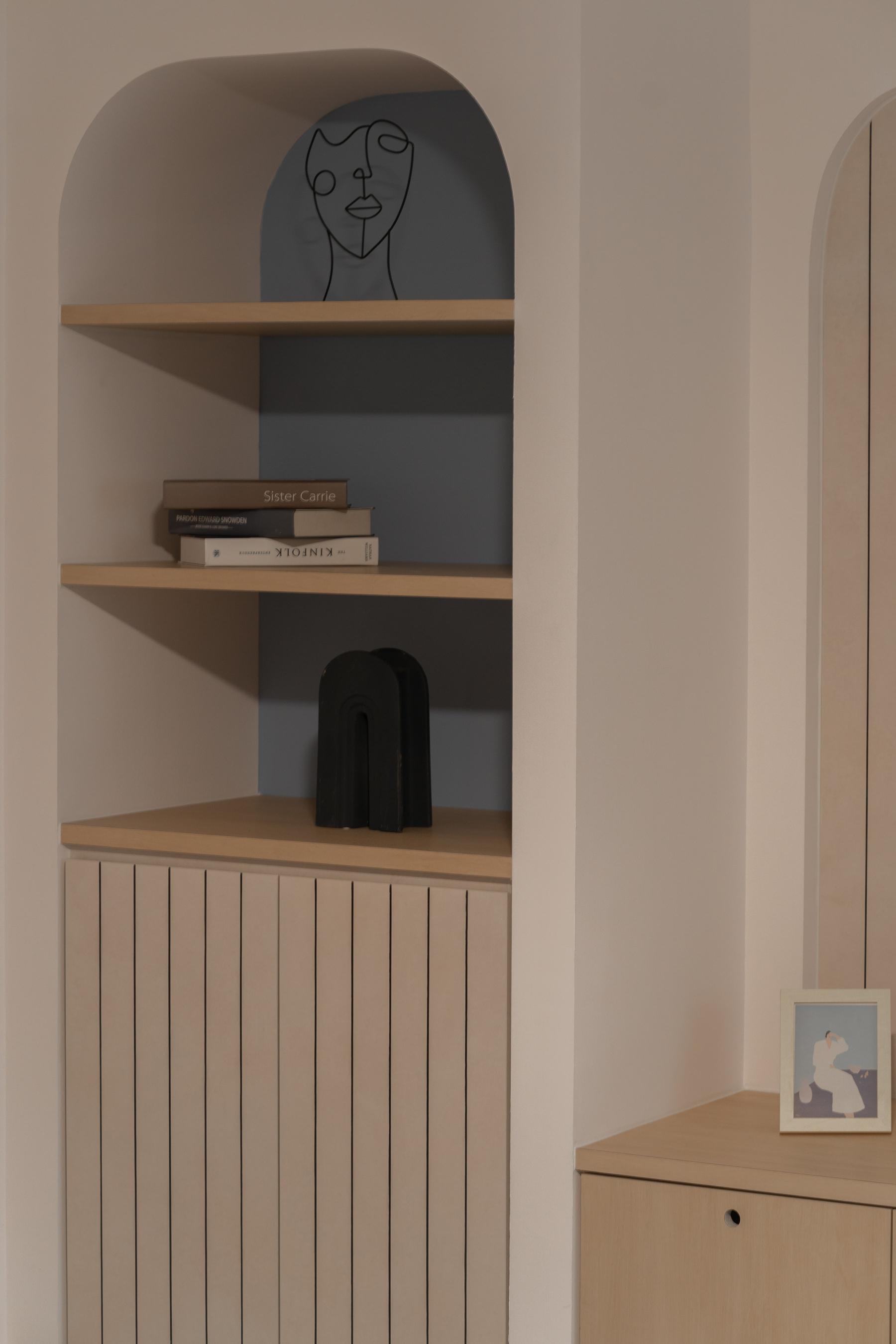 Minimalist Living Room with Bookshelf and Feature Wall