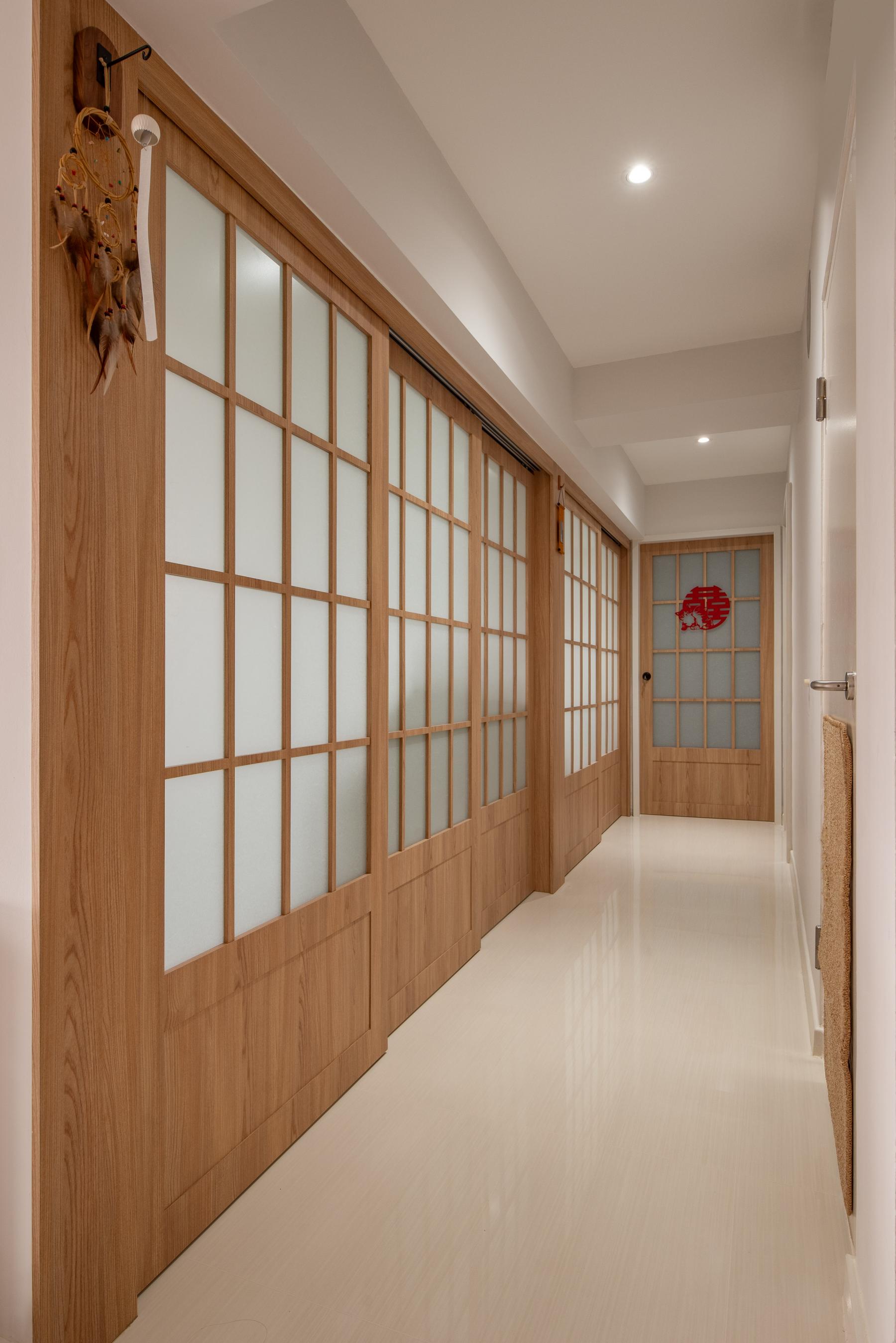 Minimalist Entryway with Feature Wall and Wood Feature Wall