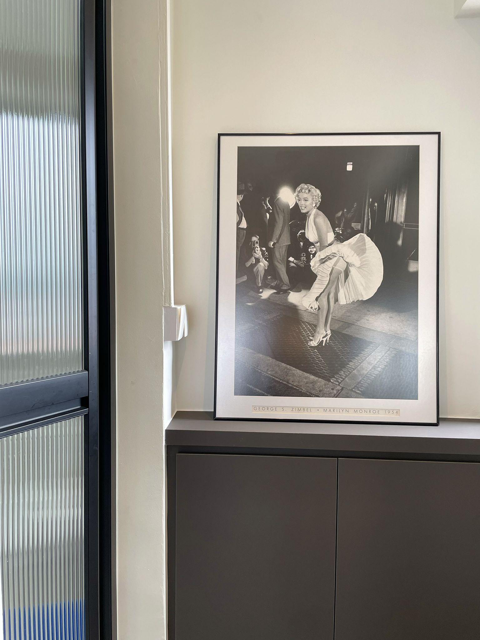 Modern Foyer with Artwork and Storage Cabinets