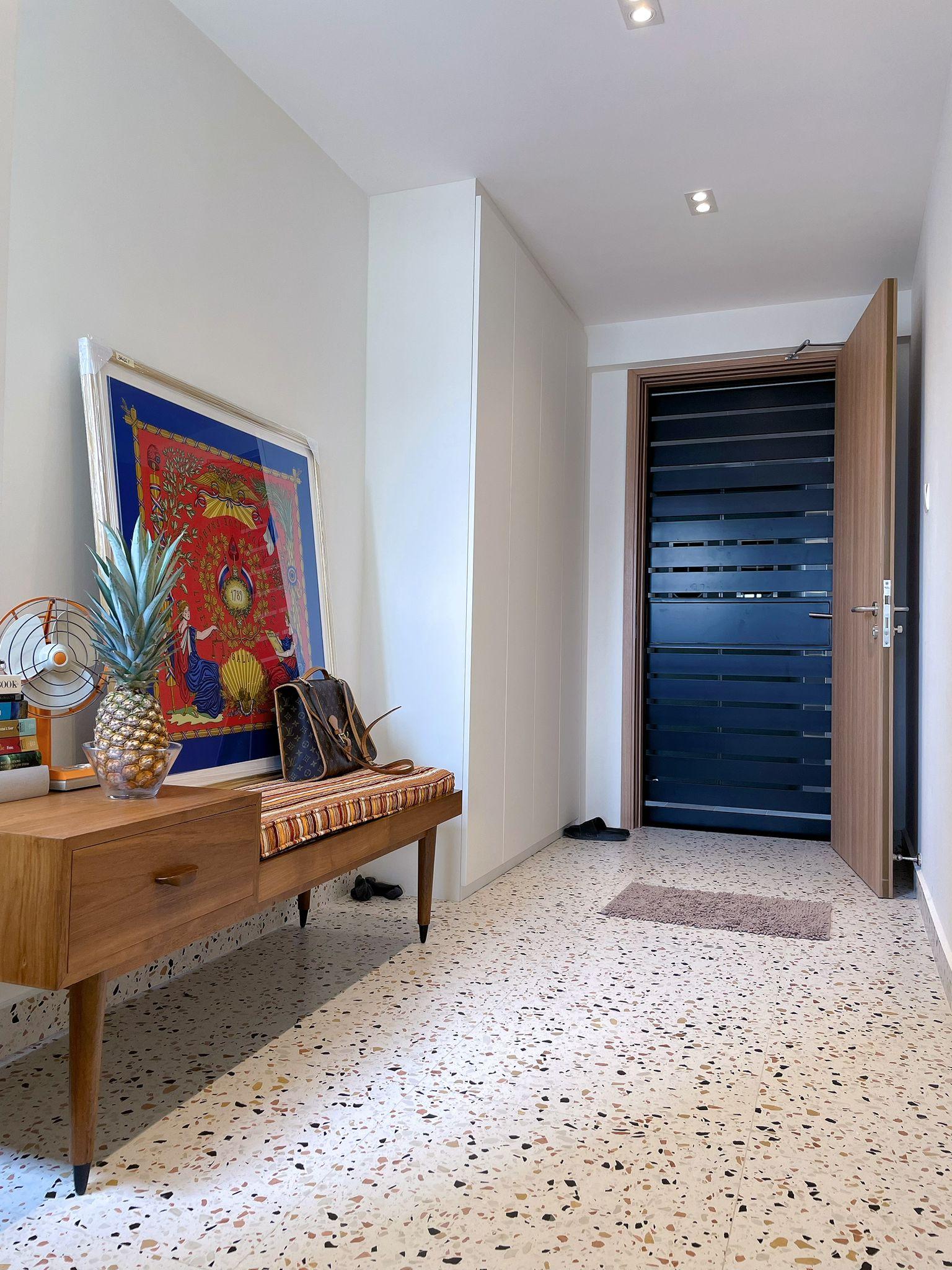 Modern Entryway with Marble Floor and Seating Bench