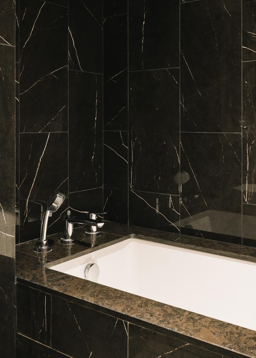 Modern Bathroom with Granite Floor and Bathtub