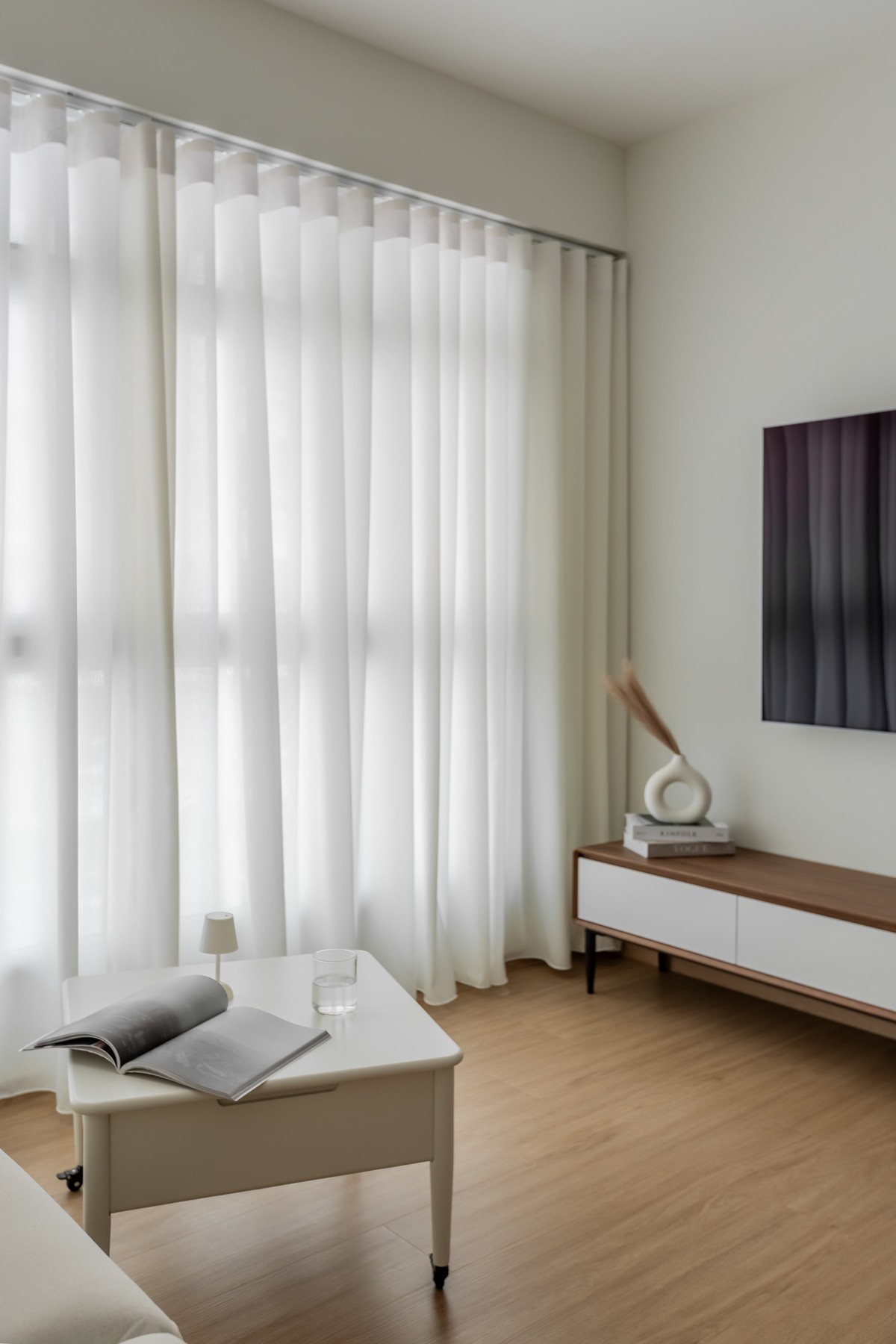 Scandinavian Living Room with TV Console and Curtain