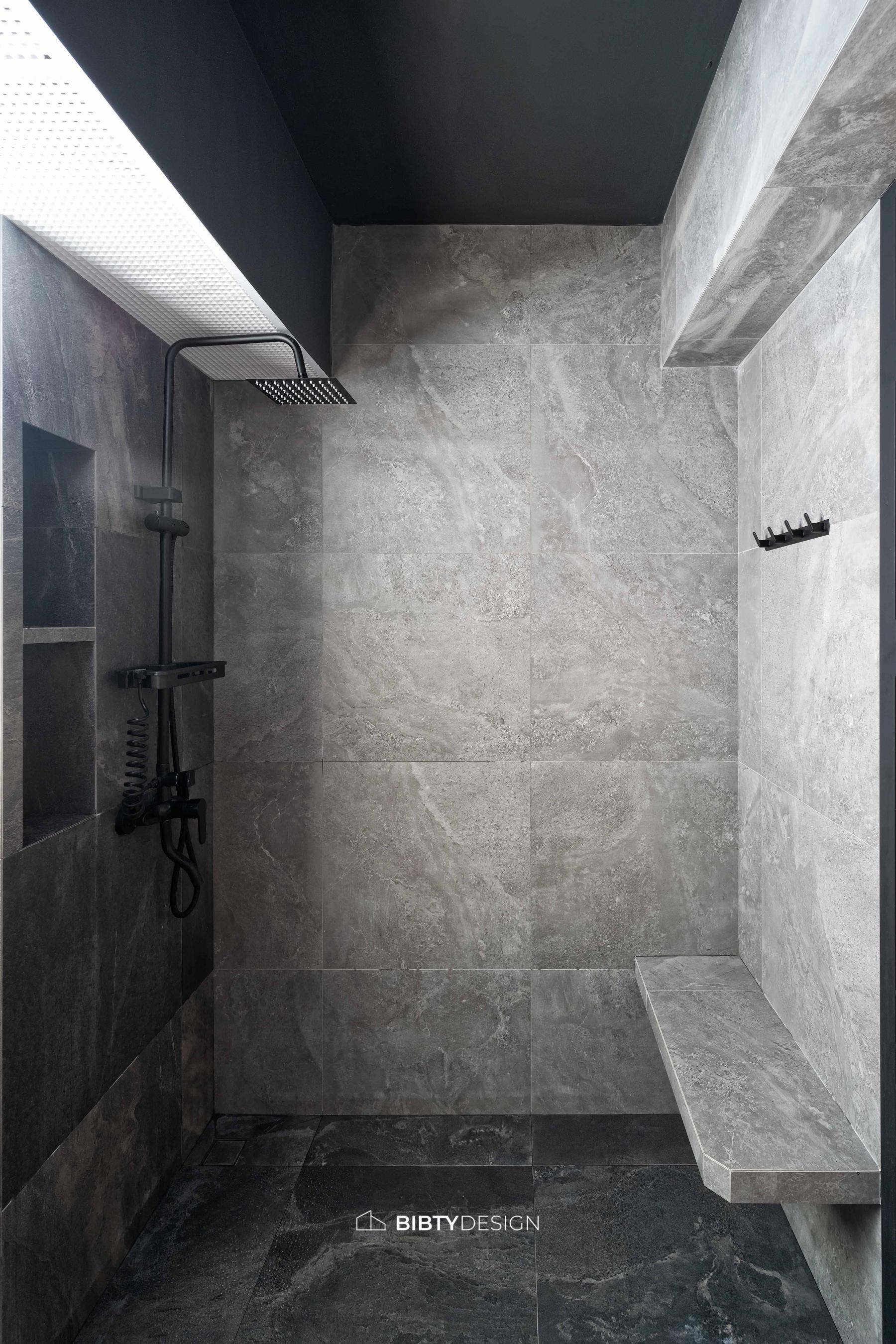 Industrial Bathroom with Homogeneous Tiles and Rainshower