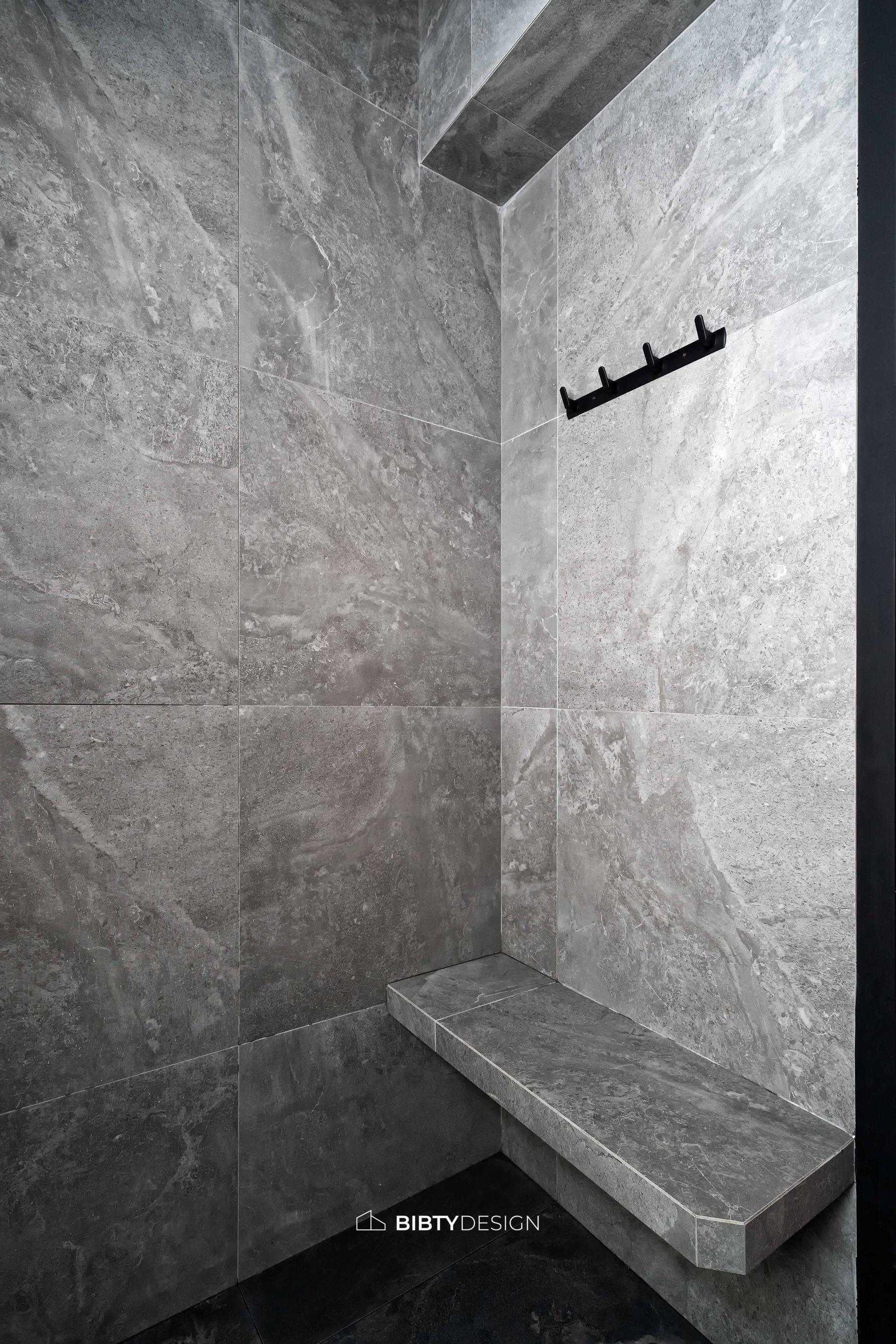 Industrial Bathroom with Homogeneous Tiles and Mirror