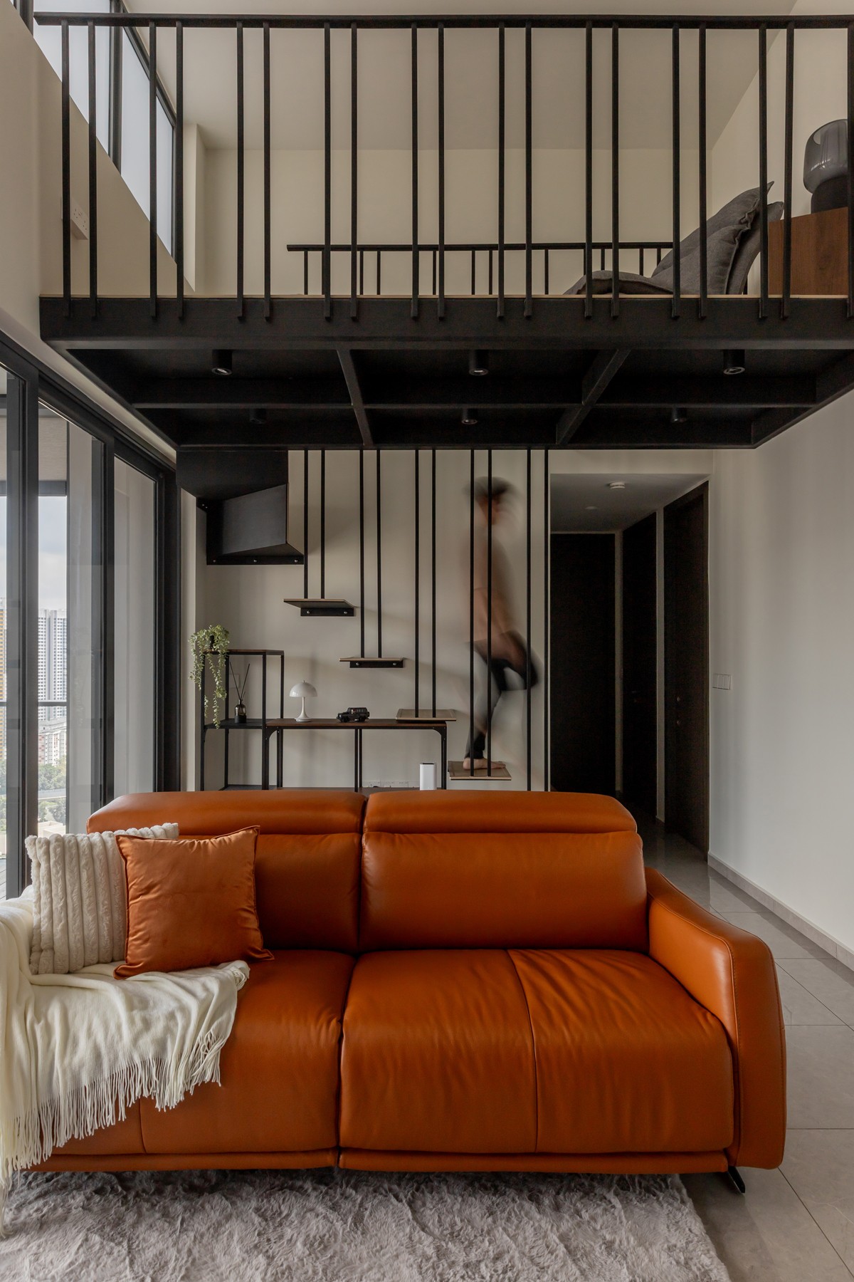 Modern Living Room with Staircase and Glass Door