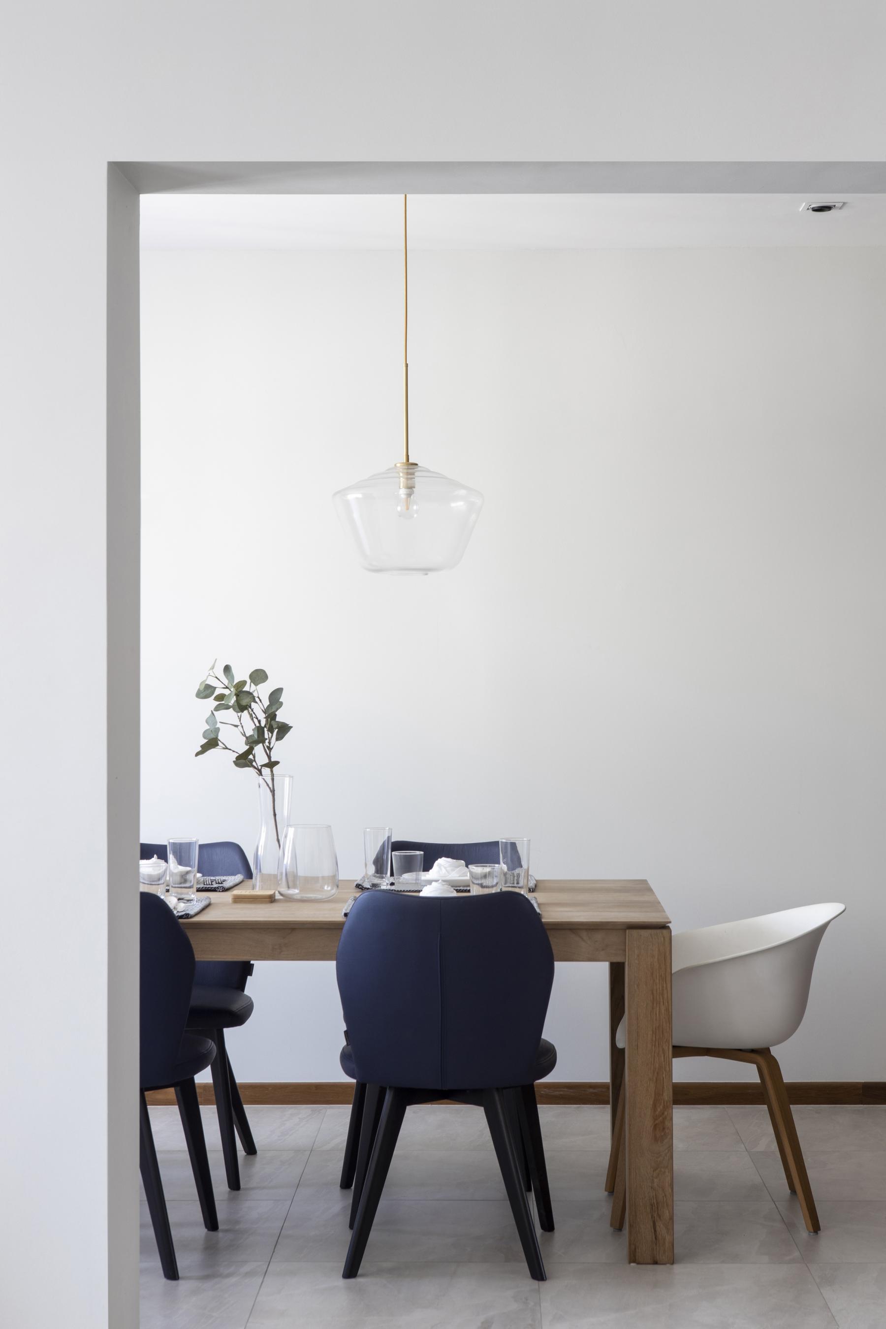 Scandinavian Dining Room with Drop Light and Dining Table