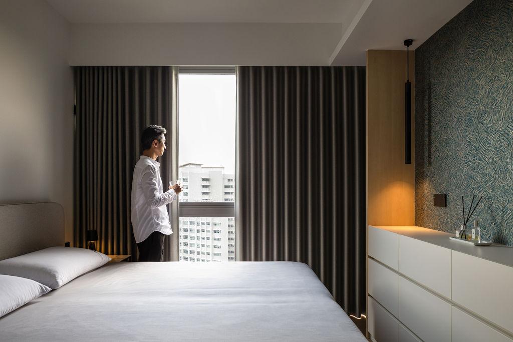 Minimalist Bedroom with Cove Lighting and Drop Ceiling