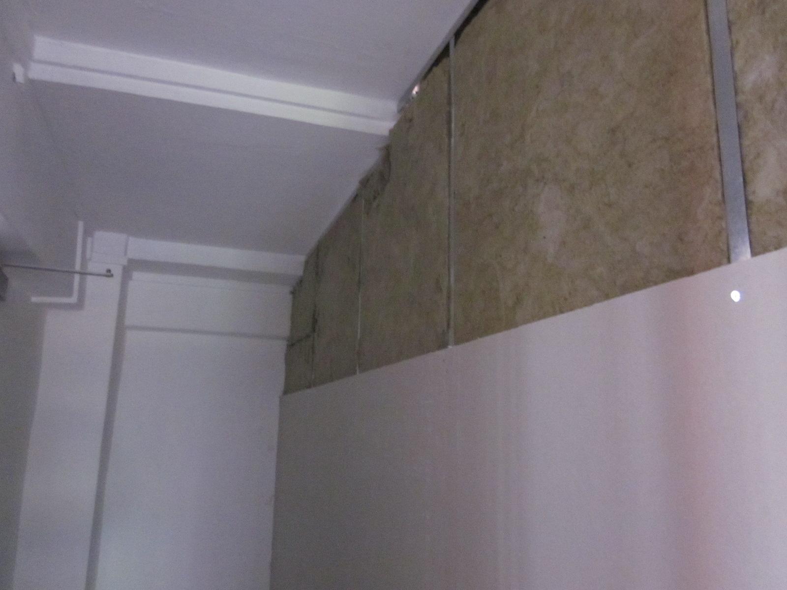Asian Living Room with Feature Wall and Mirror
