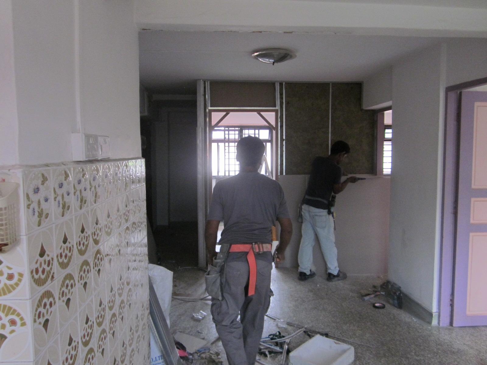Asian Living Room with Homogeneous Tiles and Feature Wall