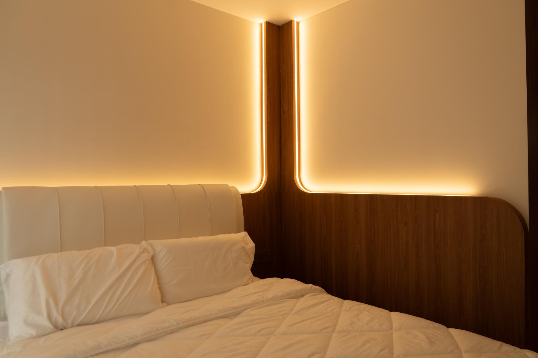Scandinavian Bedroom with Cove Lighting and Bed