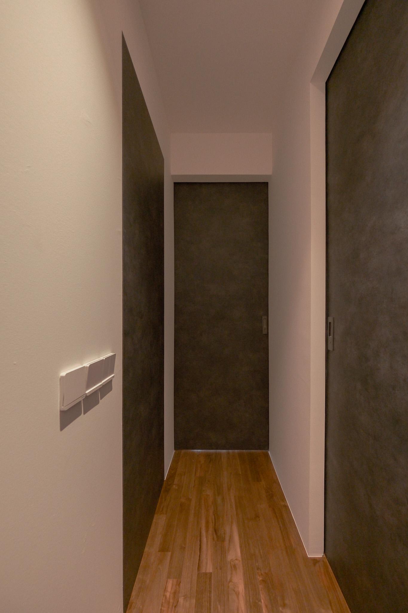 Minimalist Hallway with Bookshelf and Artwork