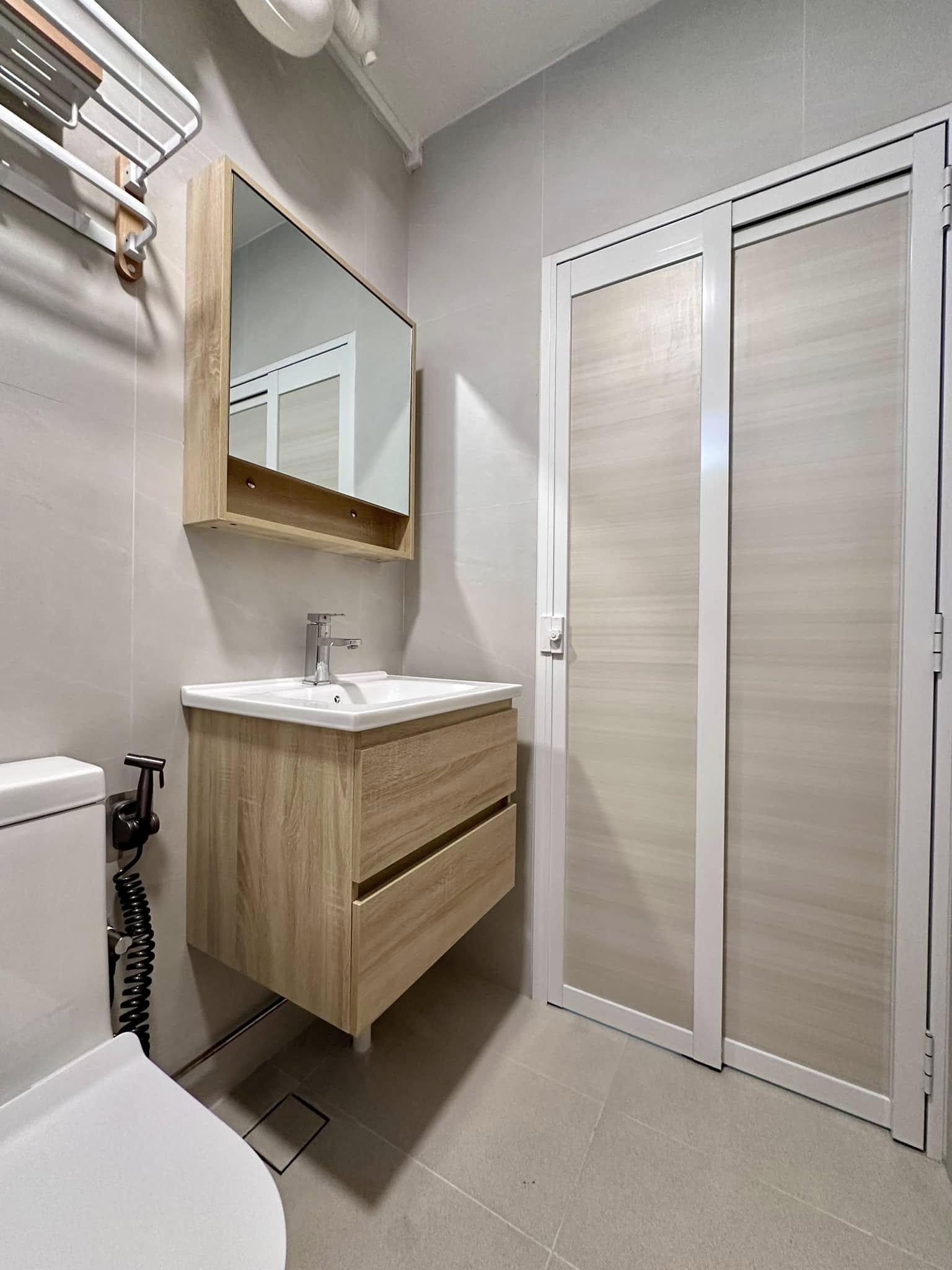 Scandinavian Bathroom with Homogeneous Tiles and Mirror