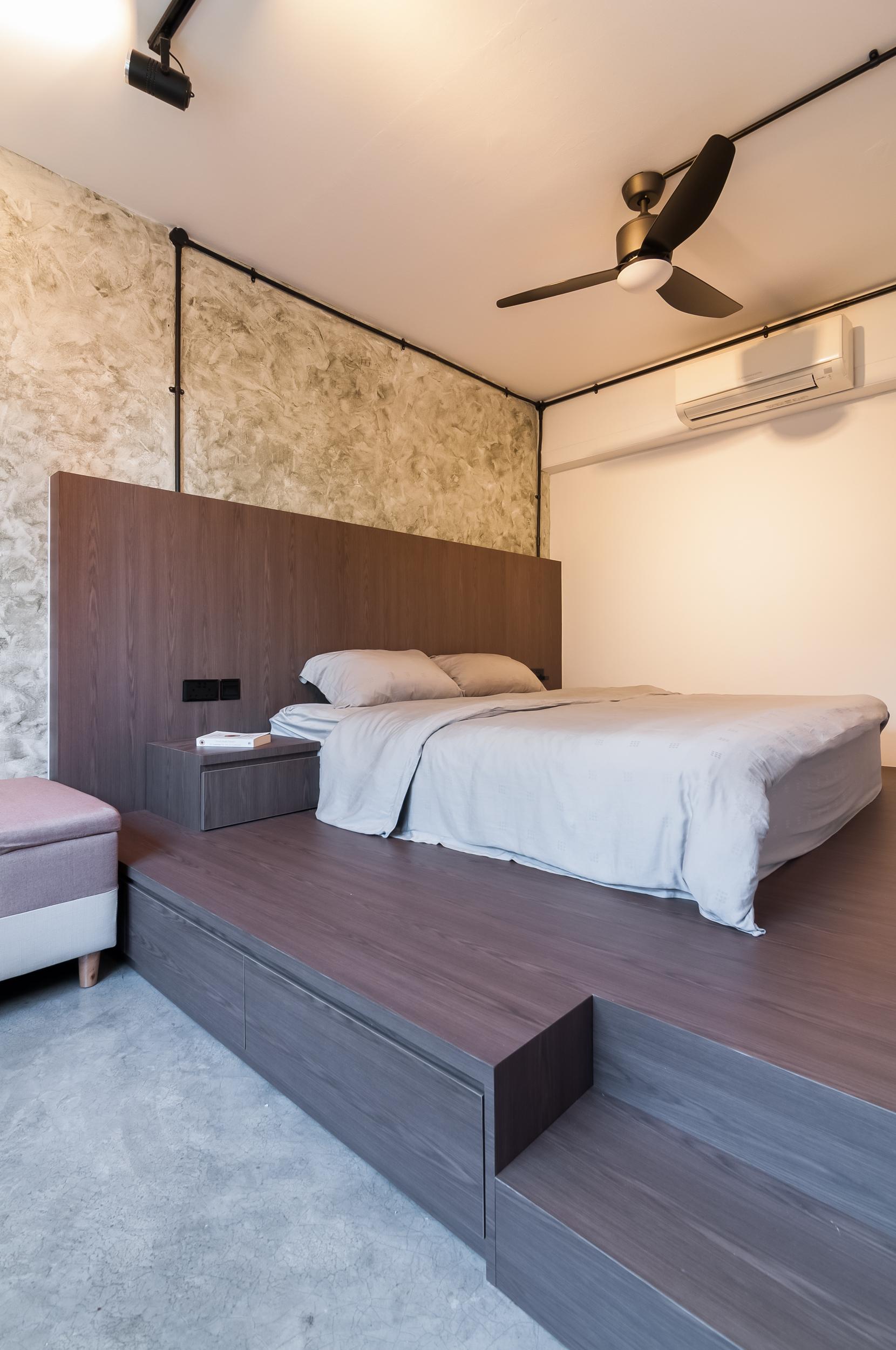 Industrial Bedroom with Platform Bed and Cement Floor