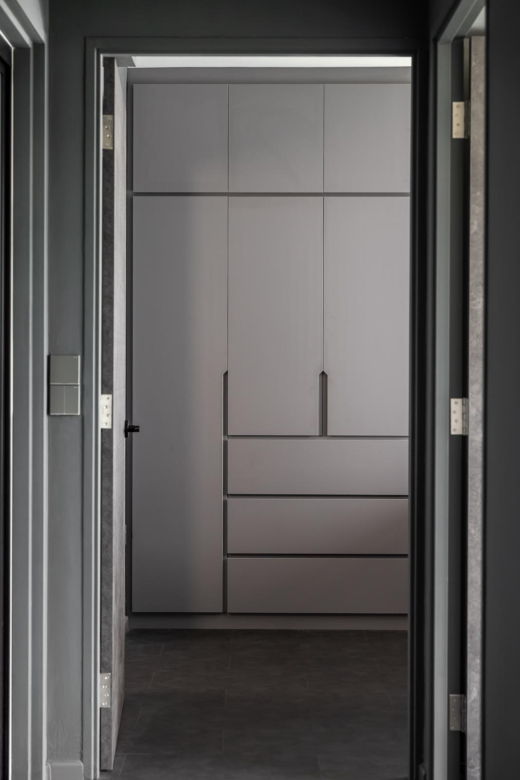 Industrial Bedroom with Homogeneous Tiles and Wardrobe