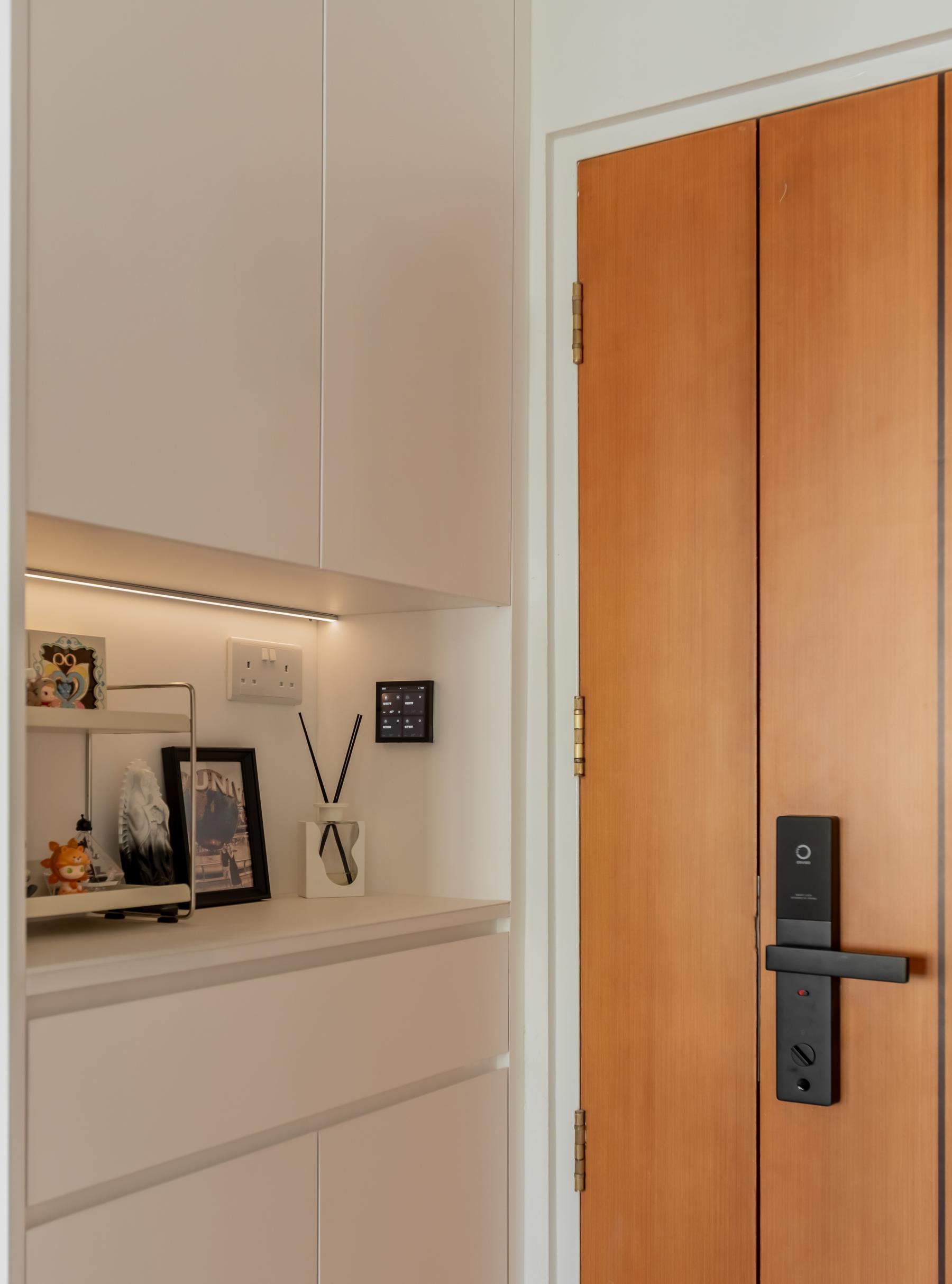 Minimalist Foyer with Storage Cabinets and Display Cabinets