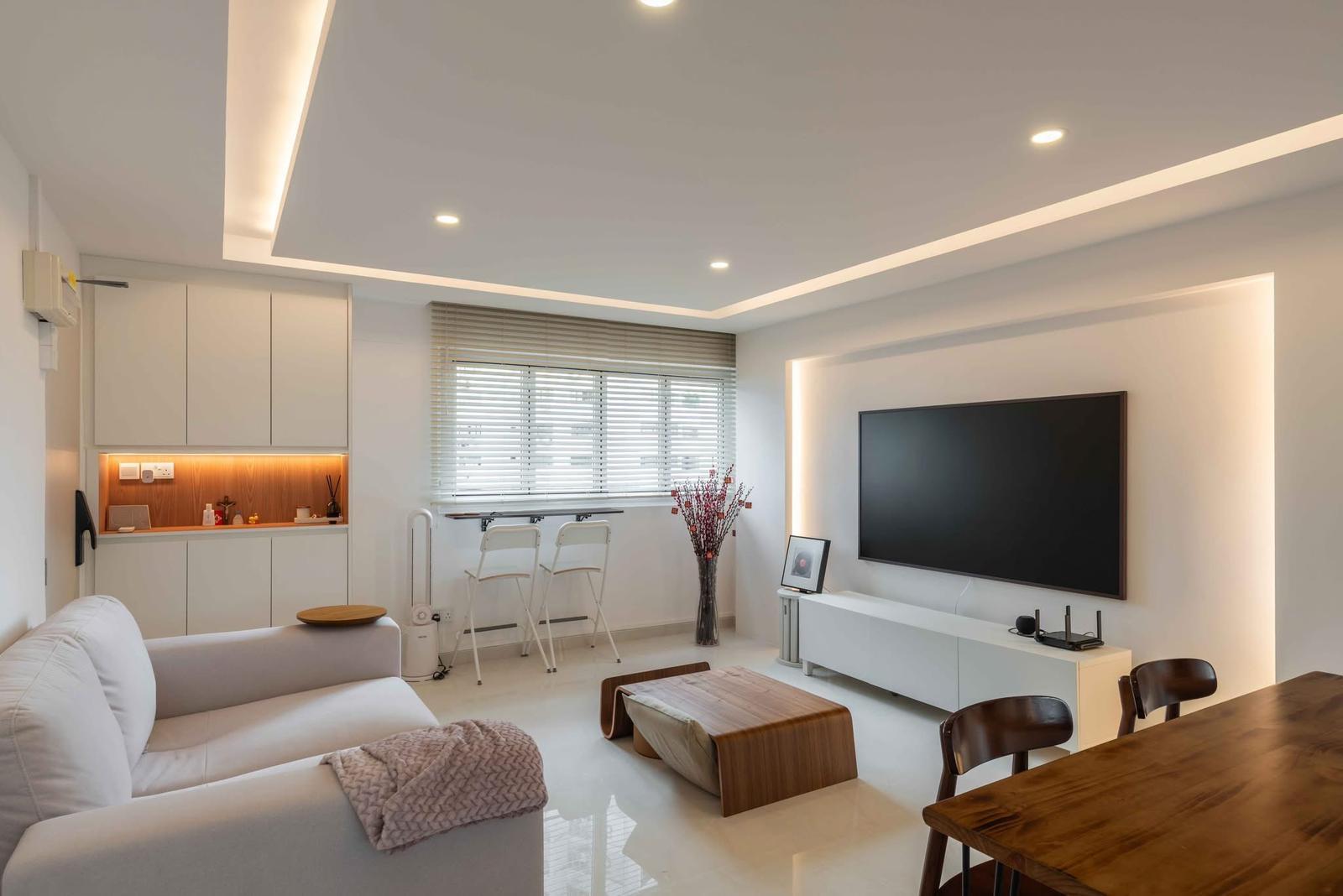 Minimalist Living Room with Bookshelf and Homogeneous Tiles
