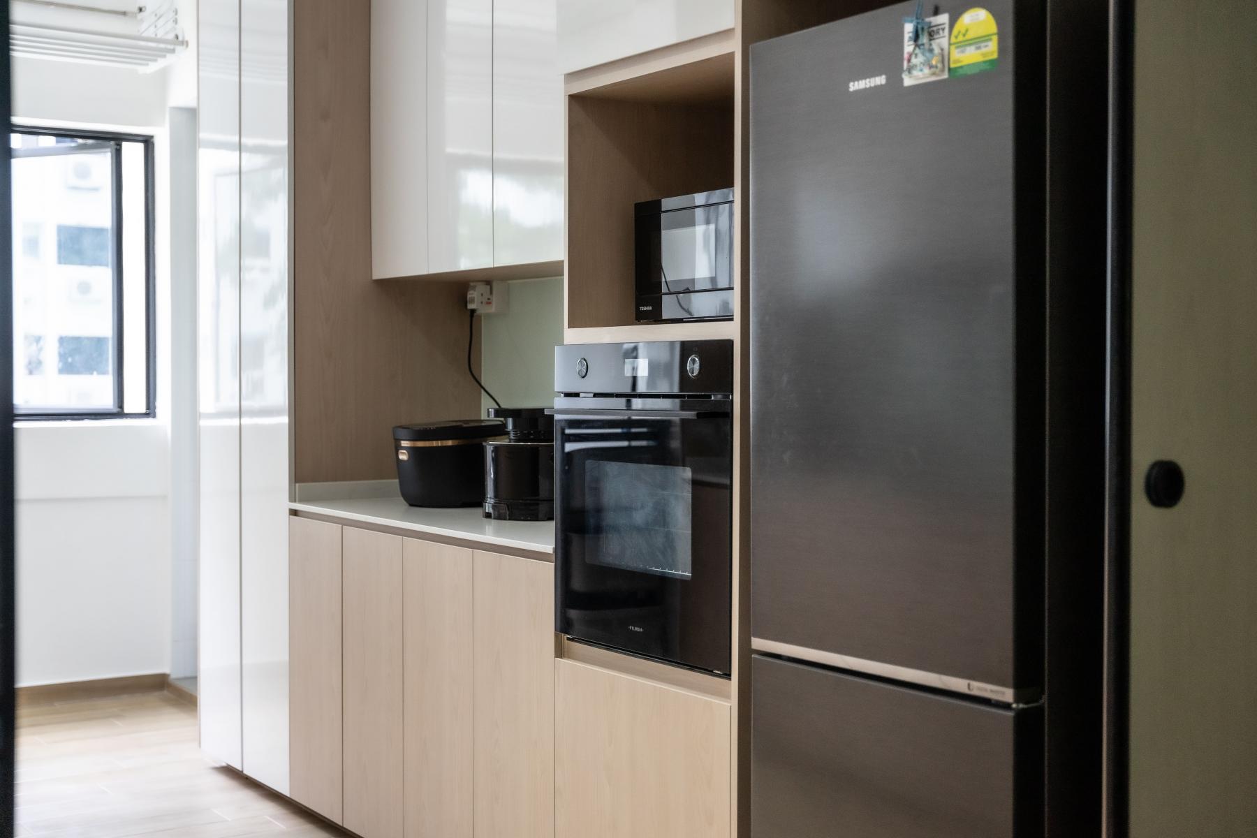 Scandinavian Kitchen with Kitchen Cabinets and Refrigerator