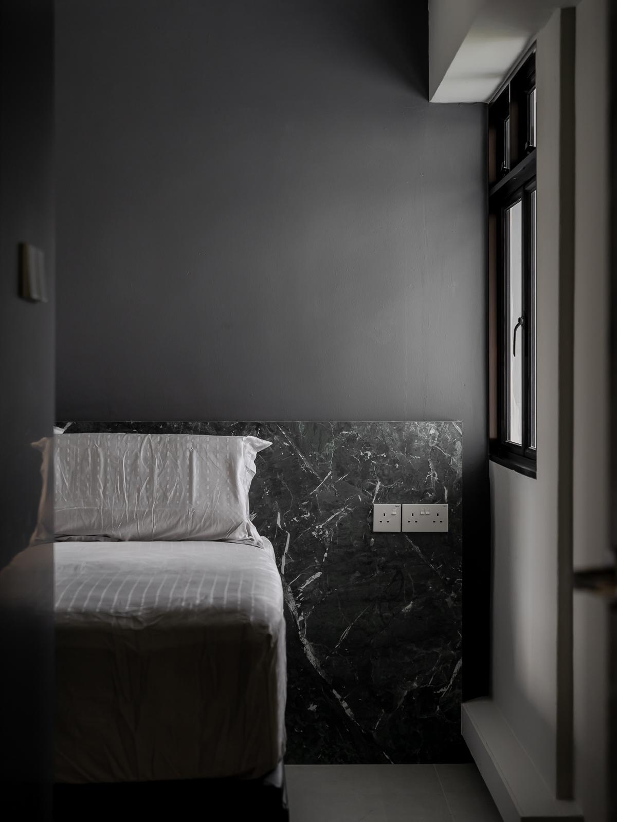 Industrial Bedroom with Drop Light and Bay Window