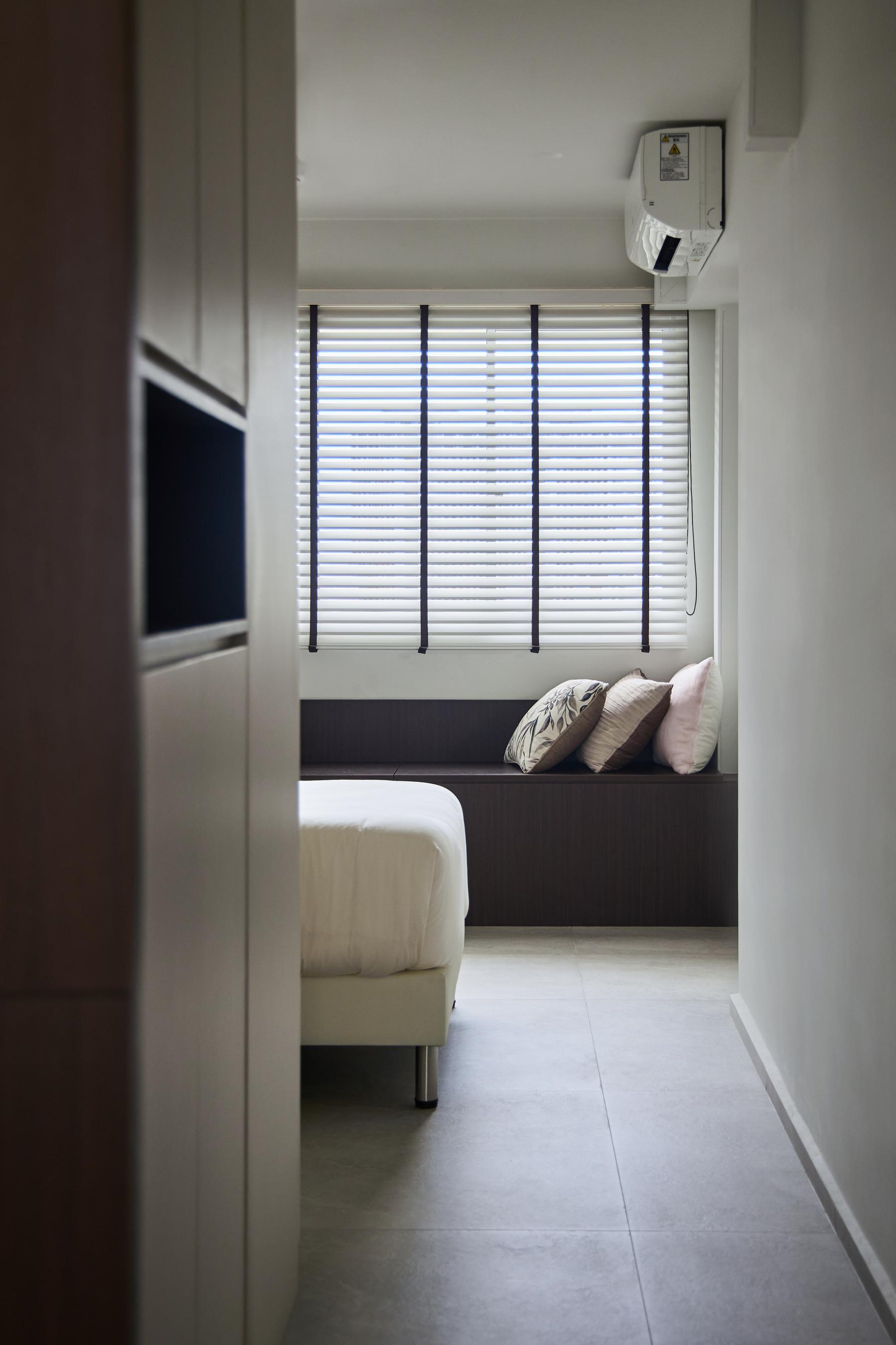 Contemporary Bedroom with Bookshelf and Homogeneous Tiles