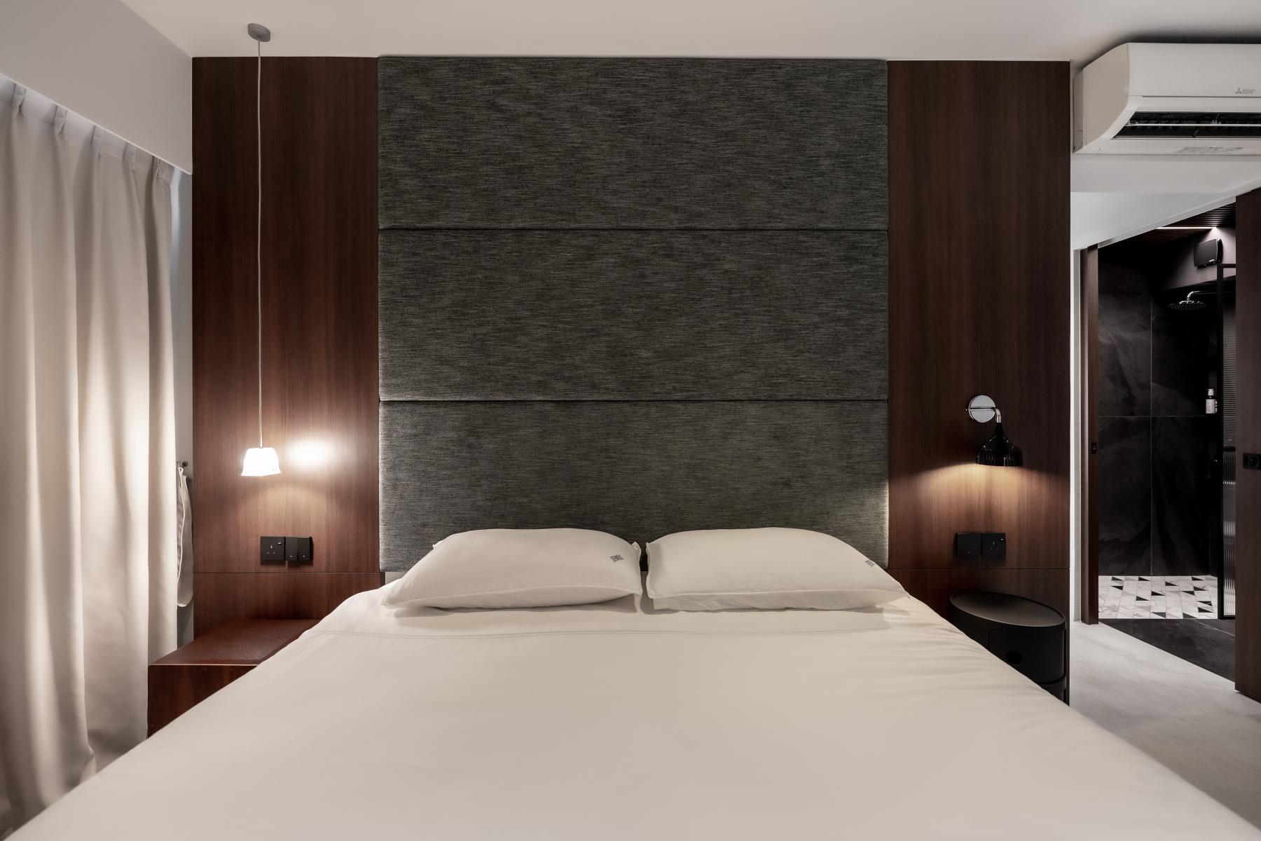 Minimalist Bedroom with Homogeneous Tiles and Drop Light