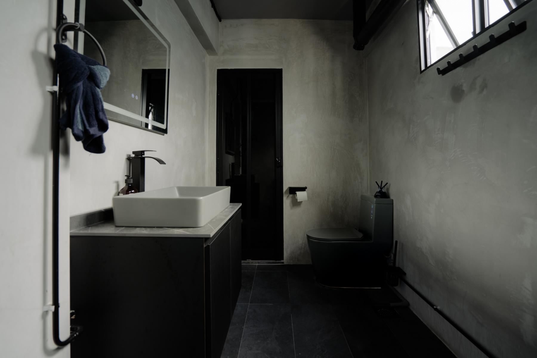 Industrial Bathroom with Herringbone Tiling and Granite Floor