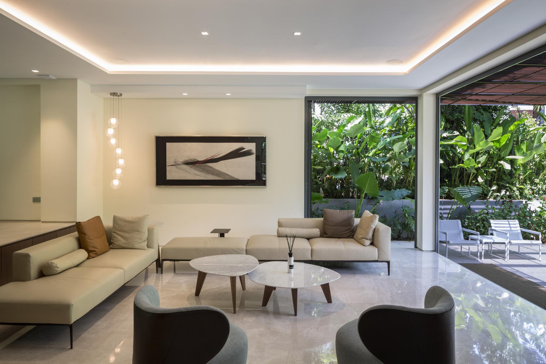 Contemporary Living Room with Marble Floor and Cove Lighting