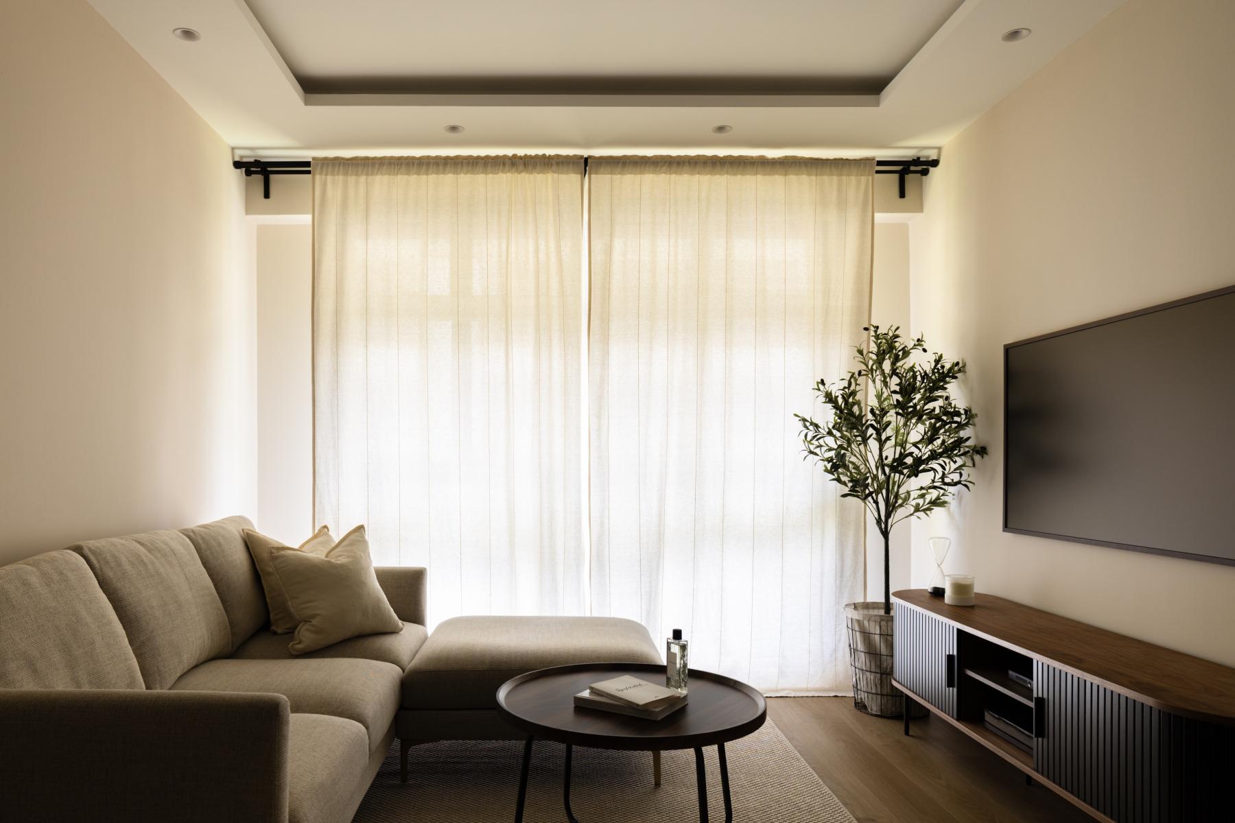 Minimalist Living Room with TV Console and Cove Lighting
