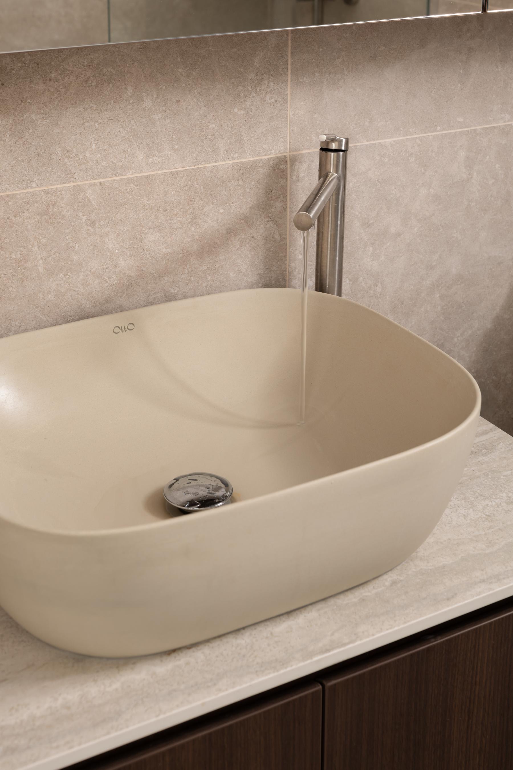 Minimalist Bathroom with Homogeneous Tiles and Bathroom Sinks
