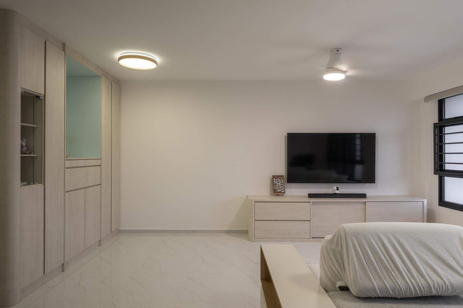 Minimalist Living Room with Homogeneous Tiles and TV Console