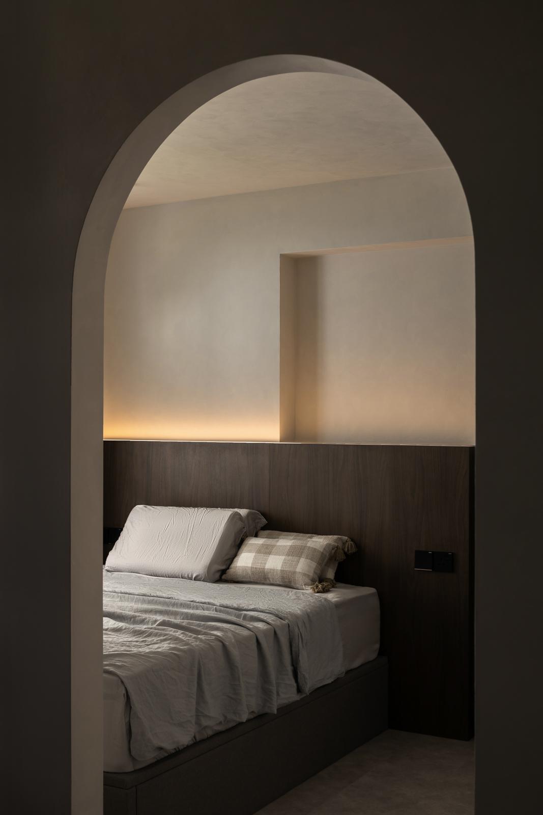 Minimalist Bedroom with Platform Bed and Cement Floor