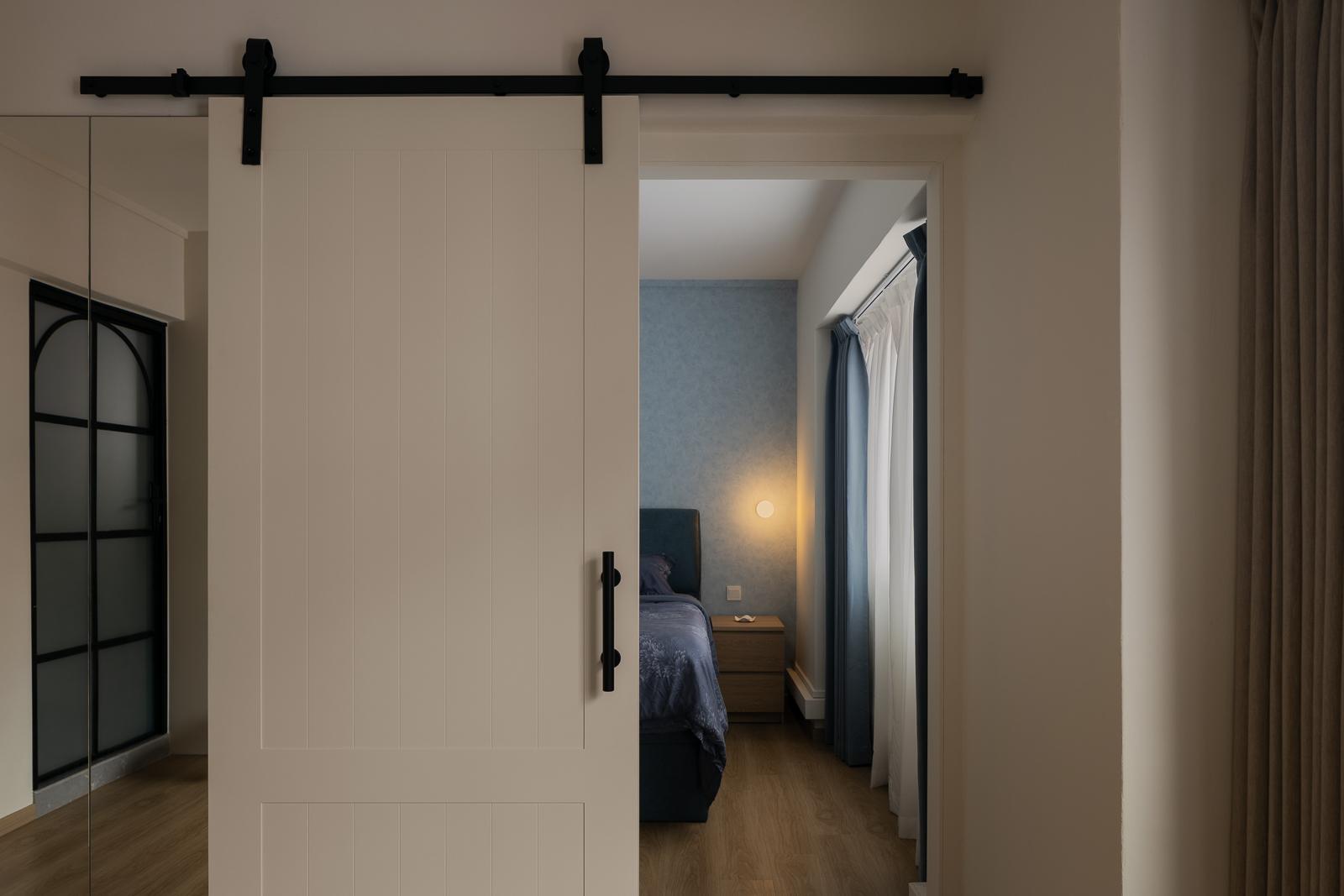Scandinavian Bedroom with Wood Flooring and Feature Wall