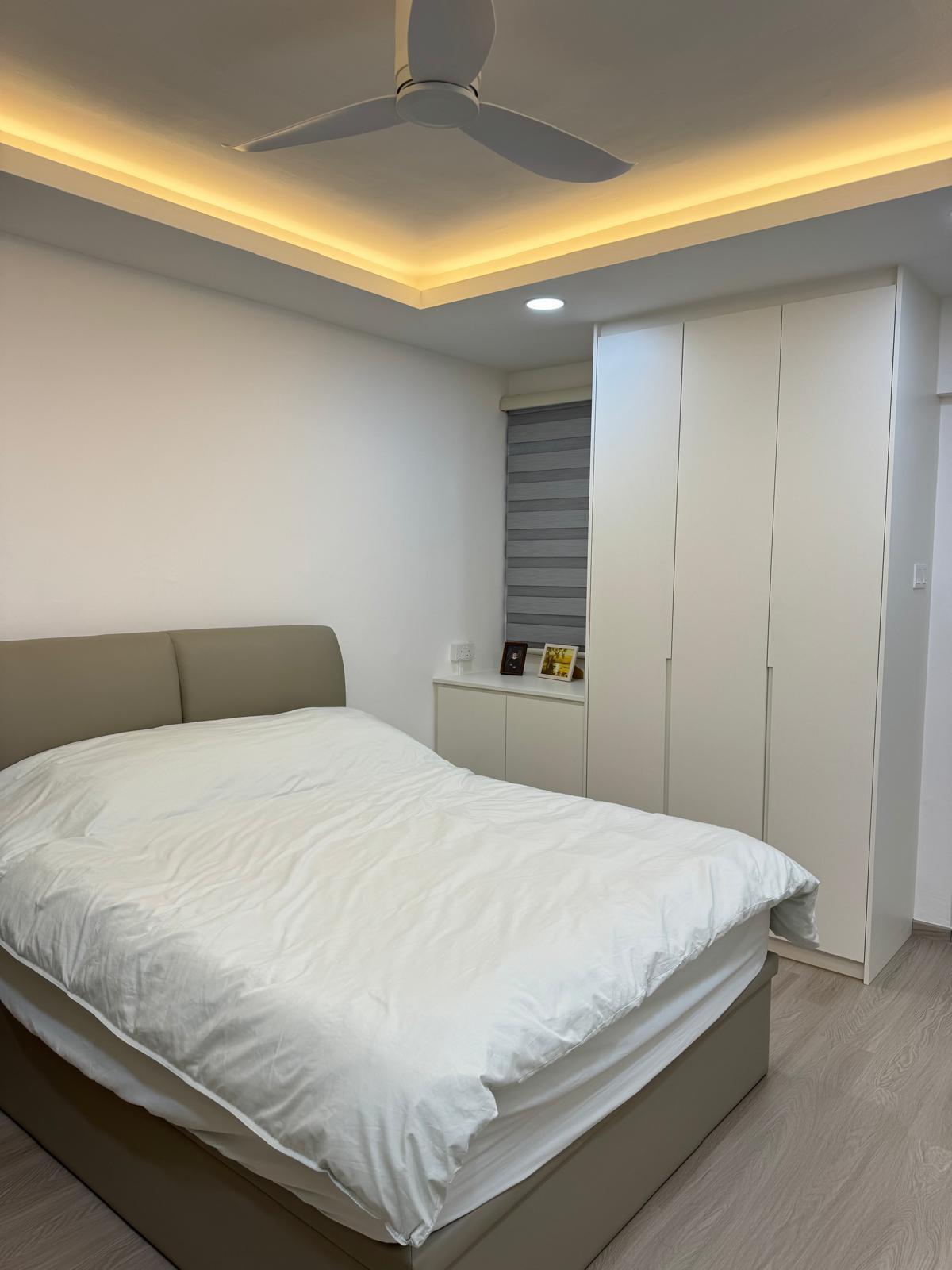 Minimalist Bedroom with Wood Flooring and Ceiling Light