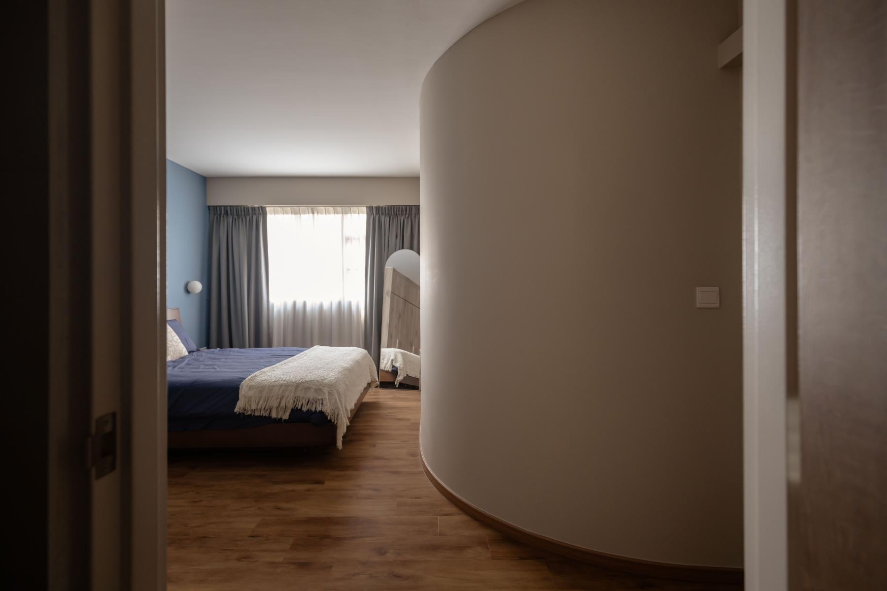 Scandinavian Bedroom with Mirror and Bed