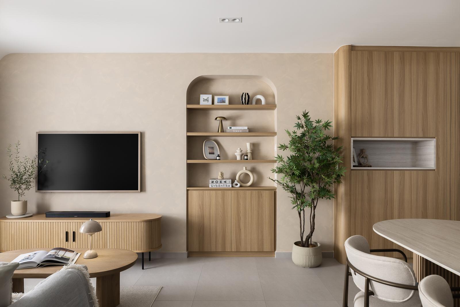 Modern Living Room with Bookshelf and Homogeneous Tiles