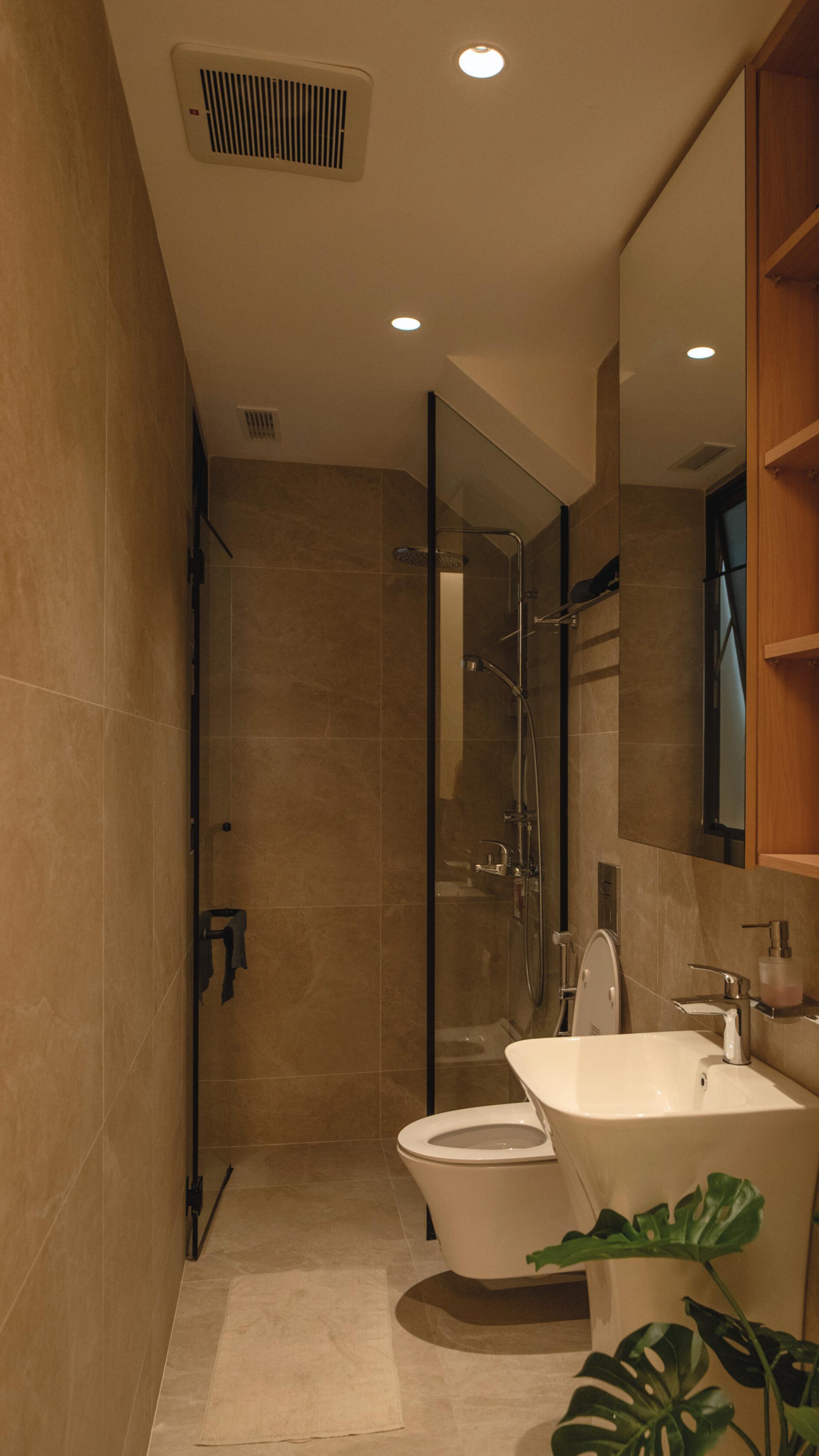 Modern Bathroom with Homogeneous Tiles and Mirror