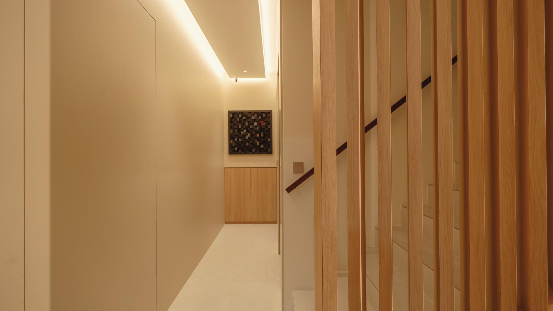 Modern Foyer with Staircase and Artwork