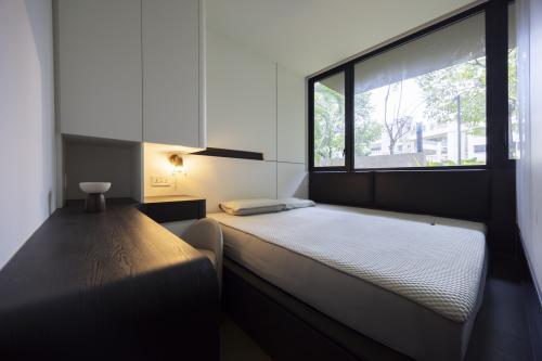 Contemporary Bedroom at Le Quests Bukit Batok